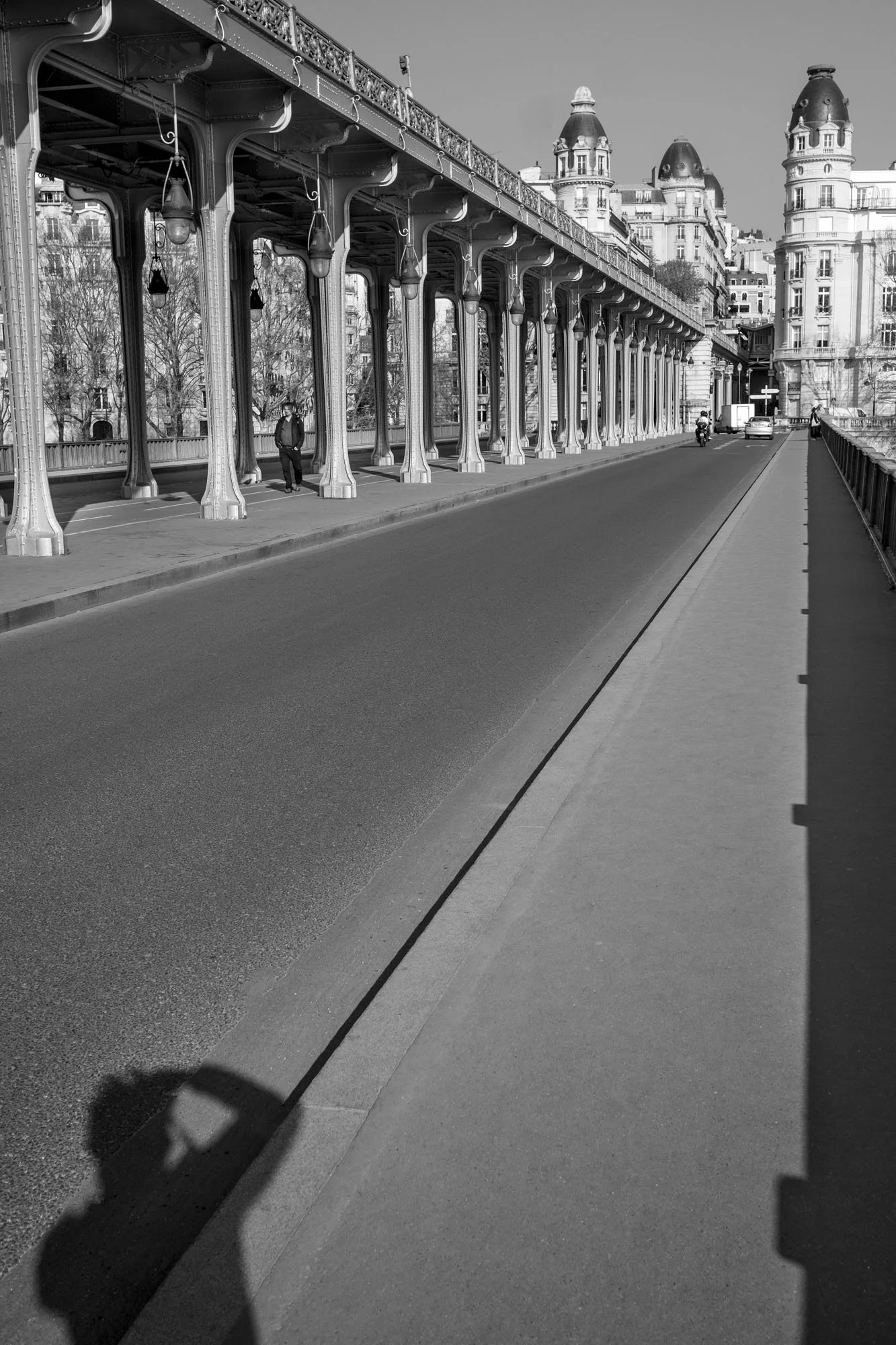  The photographer's shadow, a self-portrait, on the empty bridge, Pont de Bir-Hakeim, Paris. Photograph by Chris Perona. 