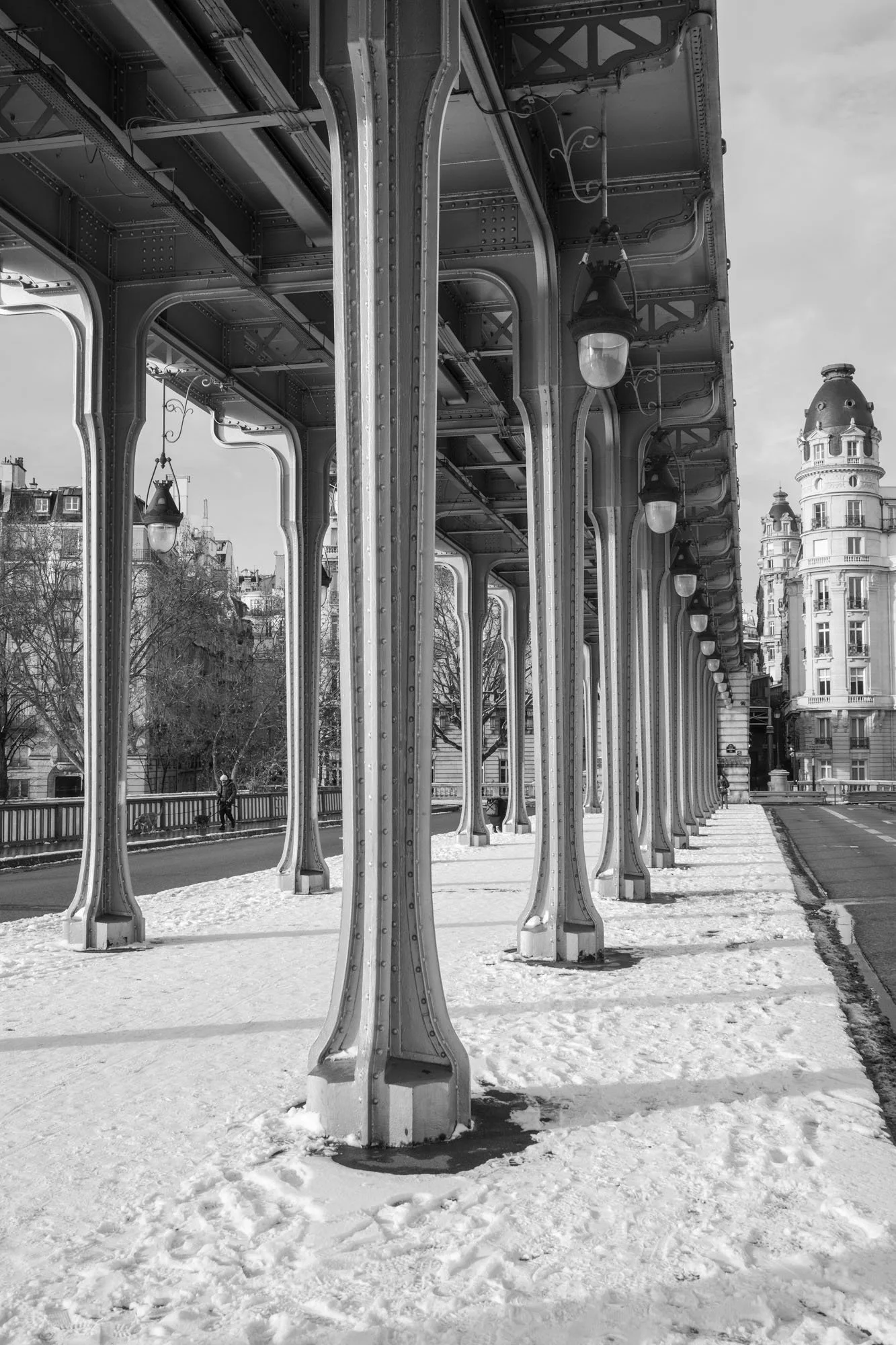  Snow covering the walkway beneath the iron colonnade, Pont de Bir-Hakeim, Paris. Architecture photograph by Chris Perona. 
