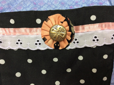 Here is a beautifully hand sewn yo-yo.