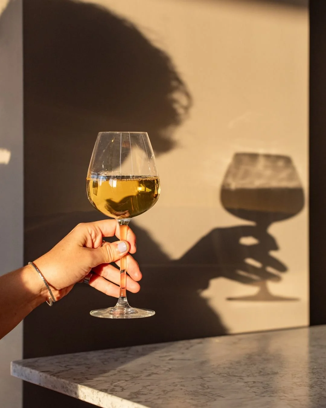 Nothing says summer like a crisp glass of wine and great view. The Rooftop at @projectsbtn is the perfect spot