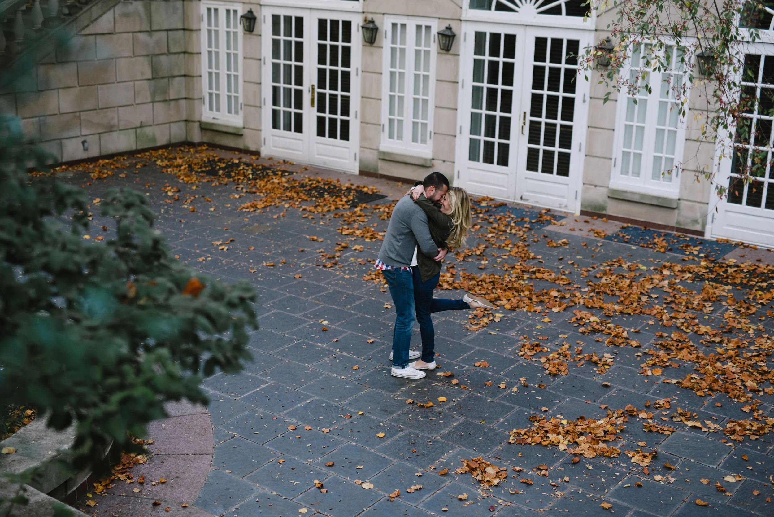 dancing in the courtyard of dumbarton oaks for engagement photos