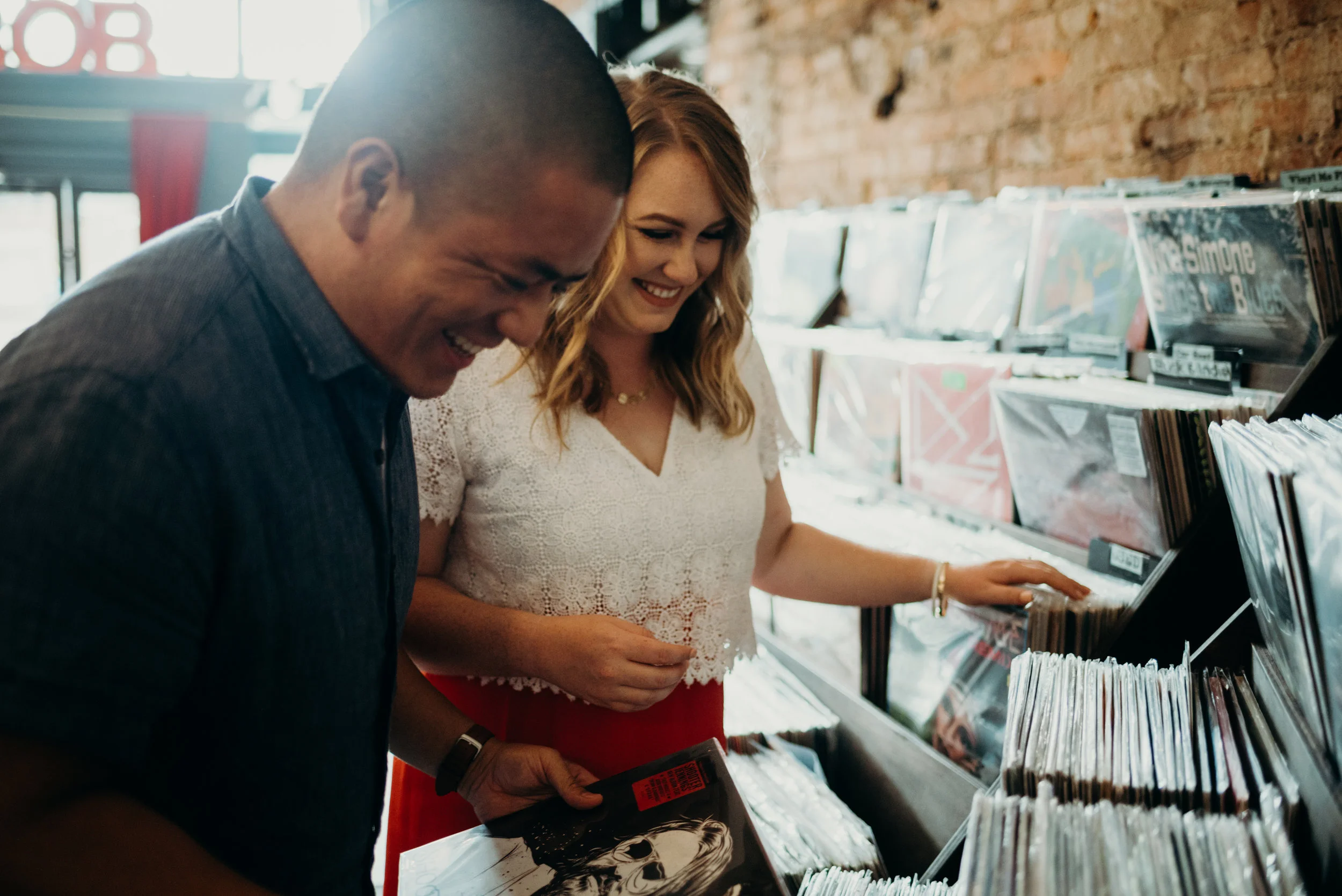 engagement photo session shopping for records at Songbyrd in Washington, D.C.