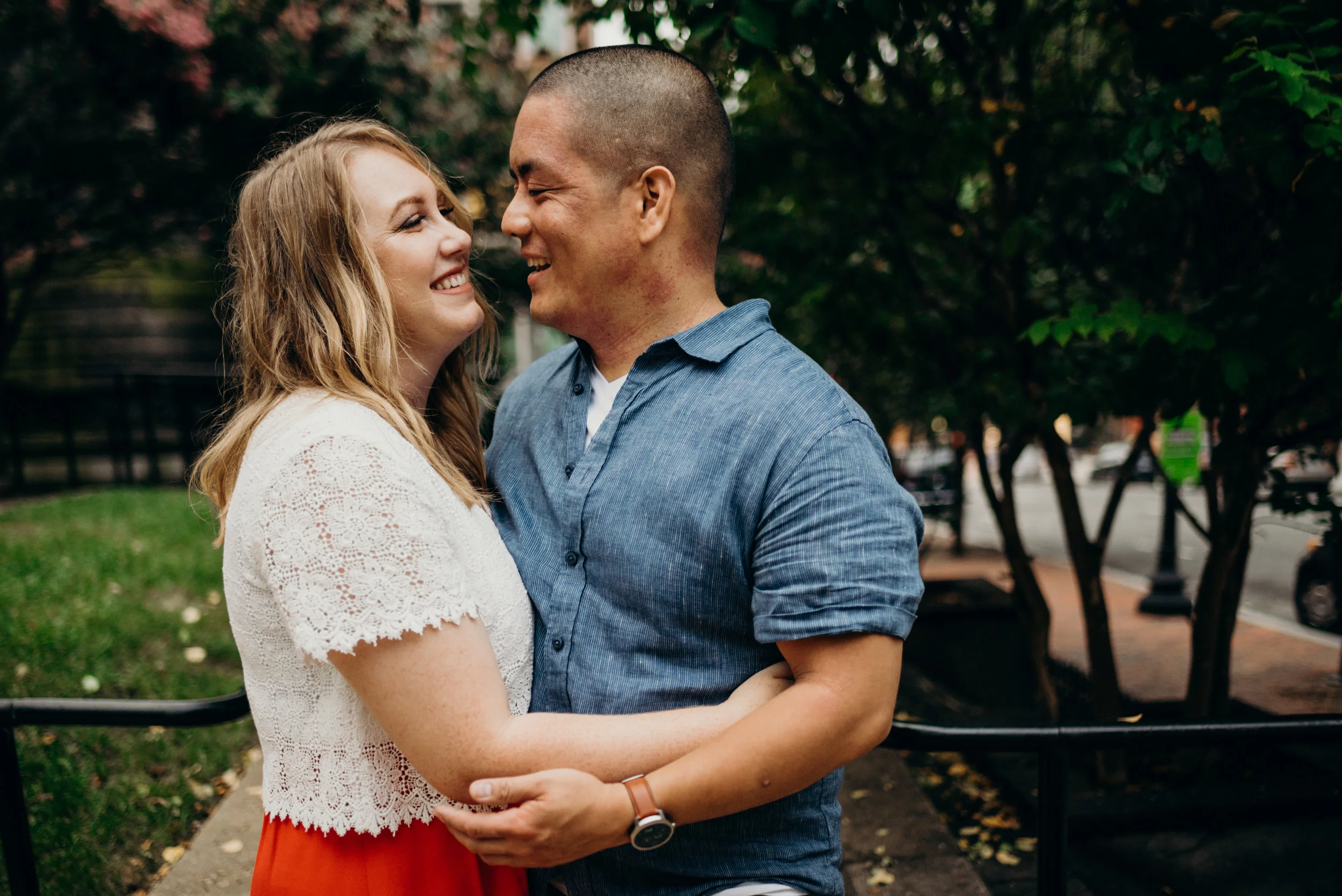 engaged couple embracing outside near the National Portrait Gallery in Washington, DC
