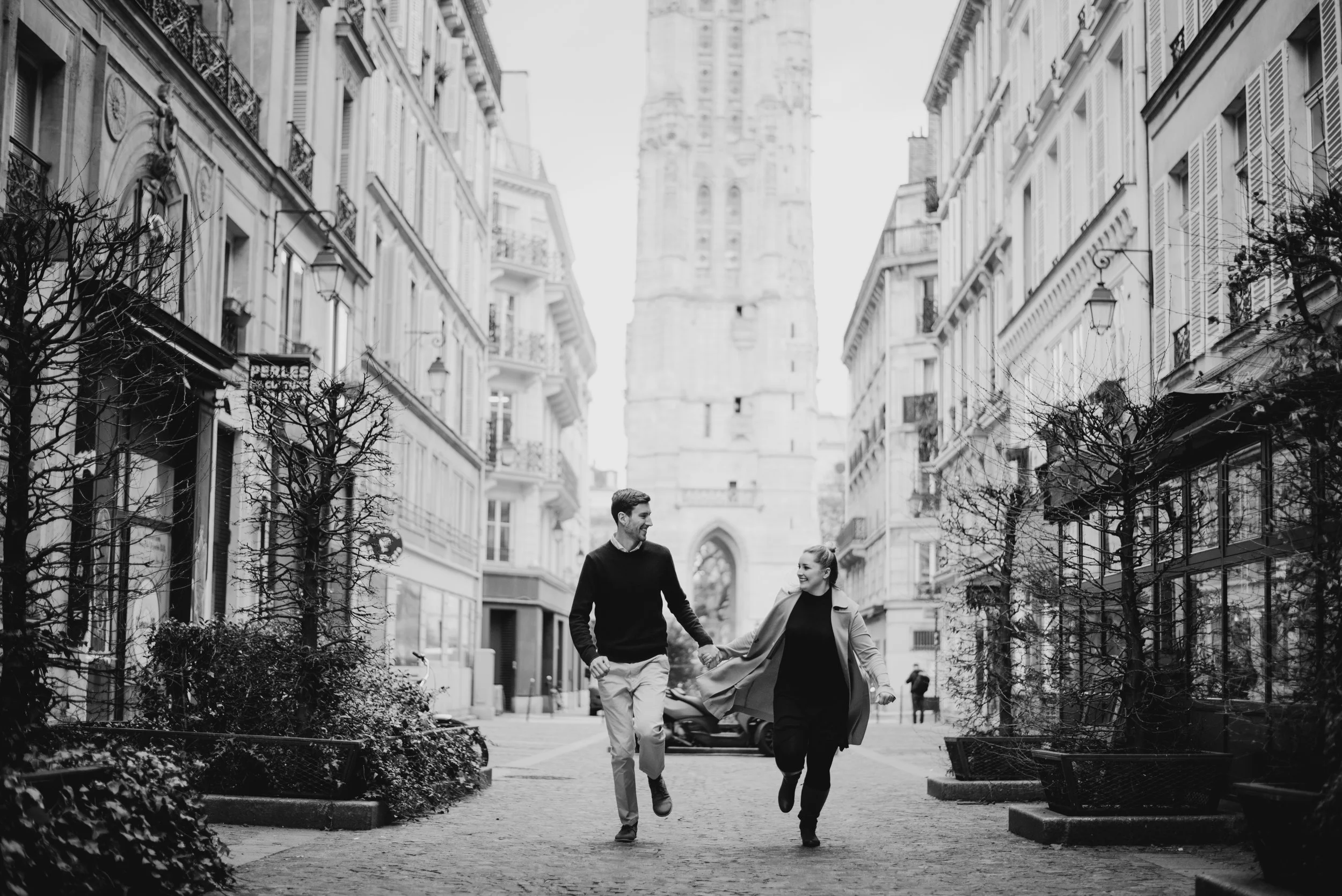 newlyweds running through Paris Streets on their honeymoon