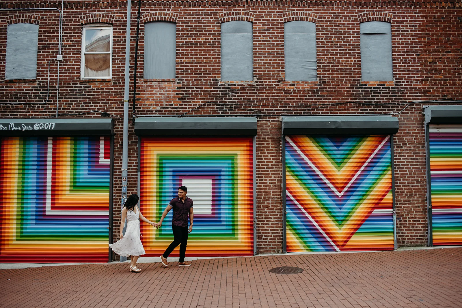 Washington DC love mural engagement session colorful rainbow skipping