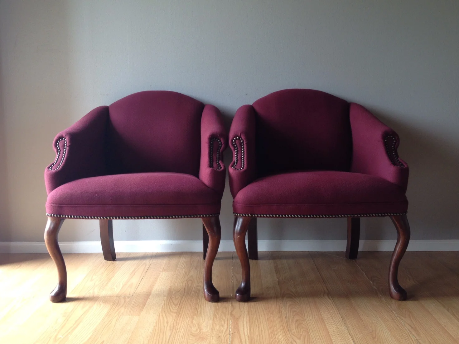 pair of vintage chairs with queen anne legs.