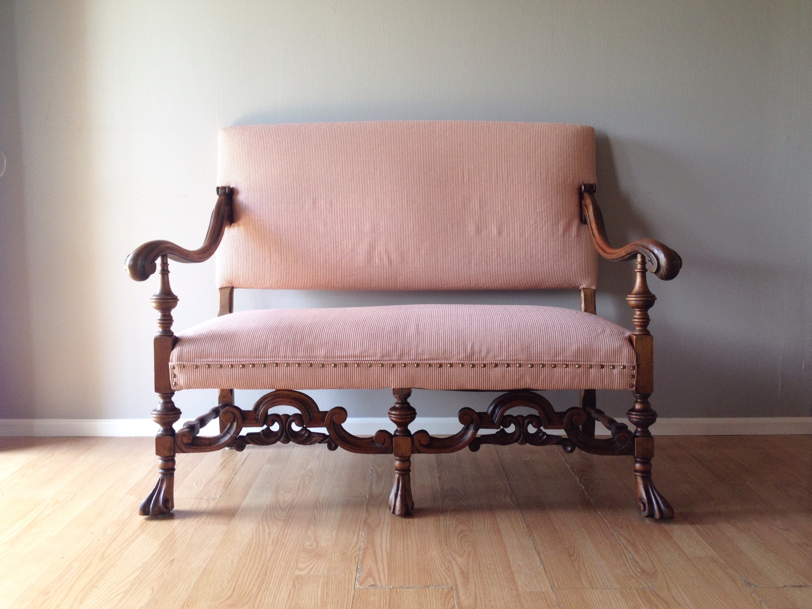 antique turn of the century carved settee.