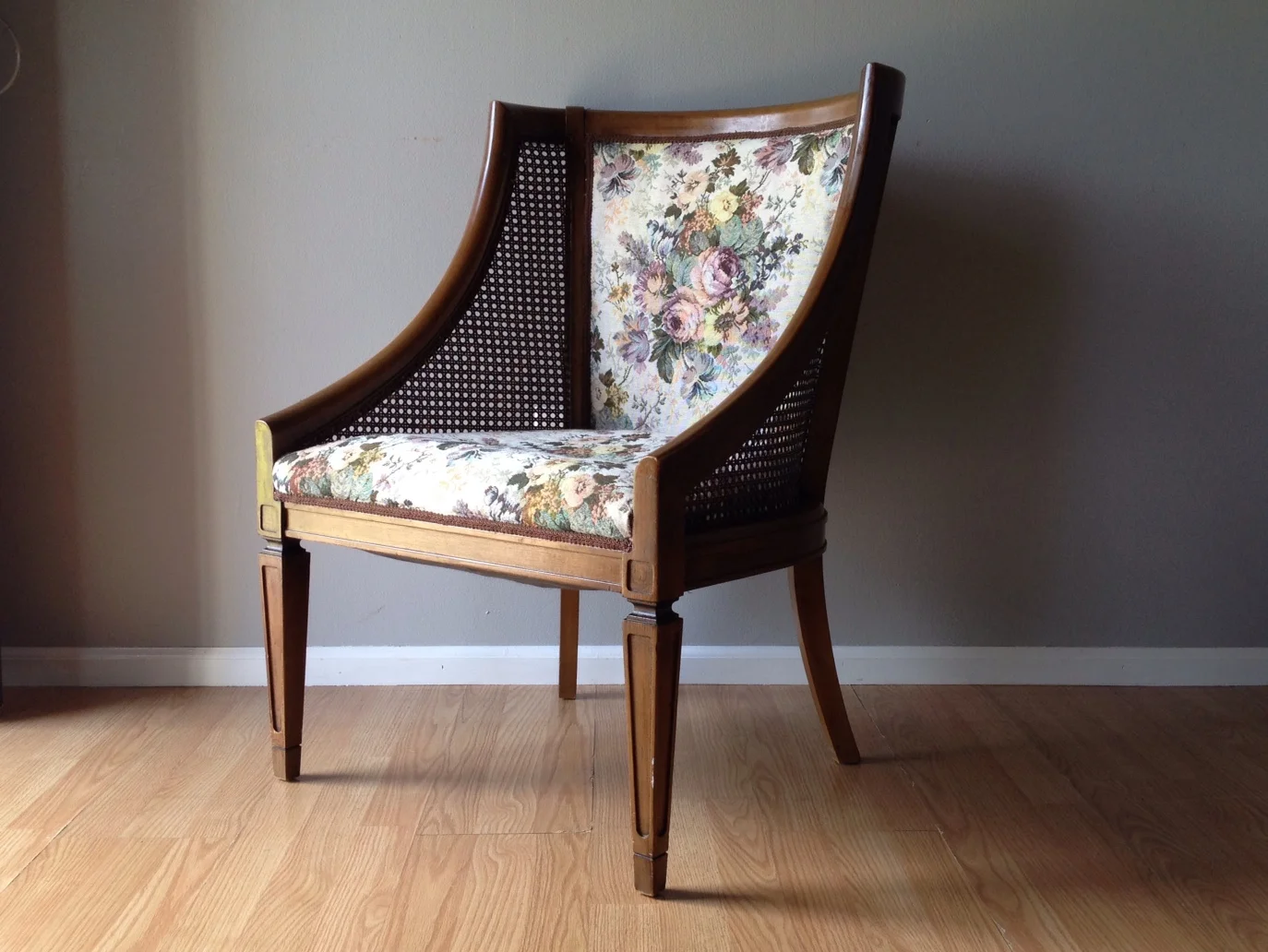 vintage occasional chair with cane sides.
