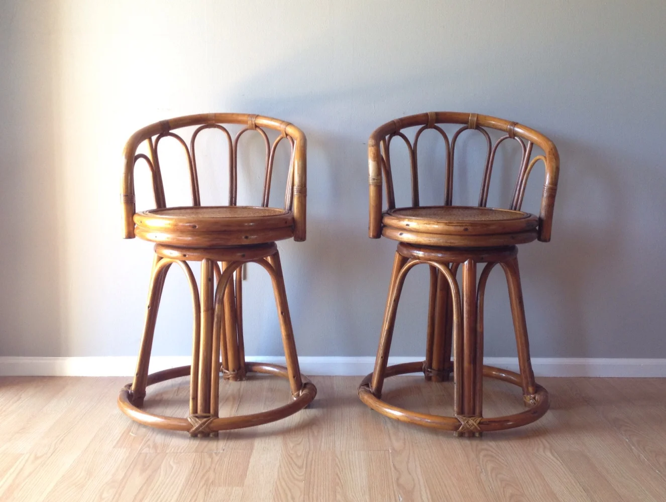 pair of vintage rattan stools.