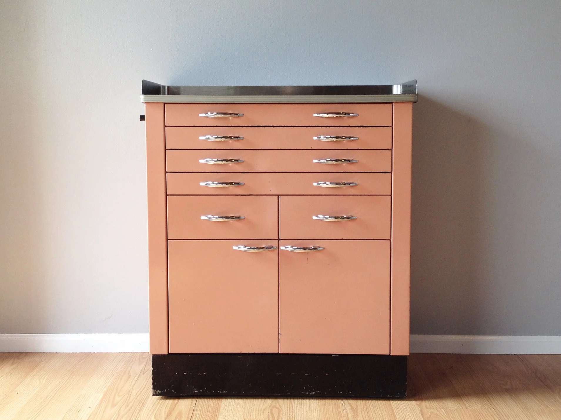 vintage 50s pink metal medical cabinet.