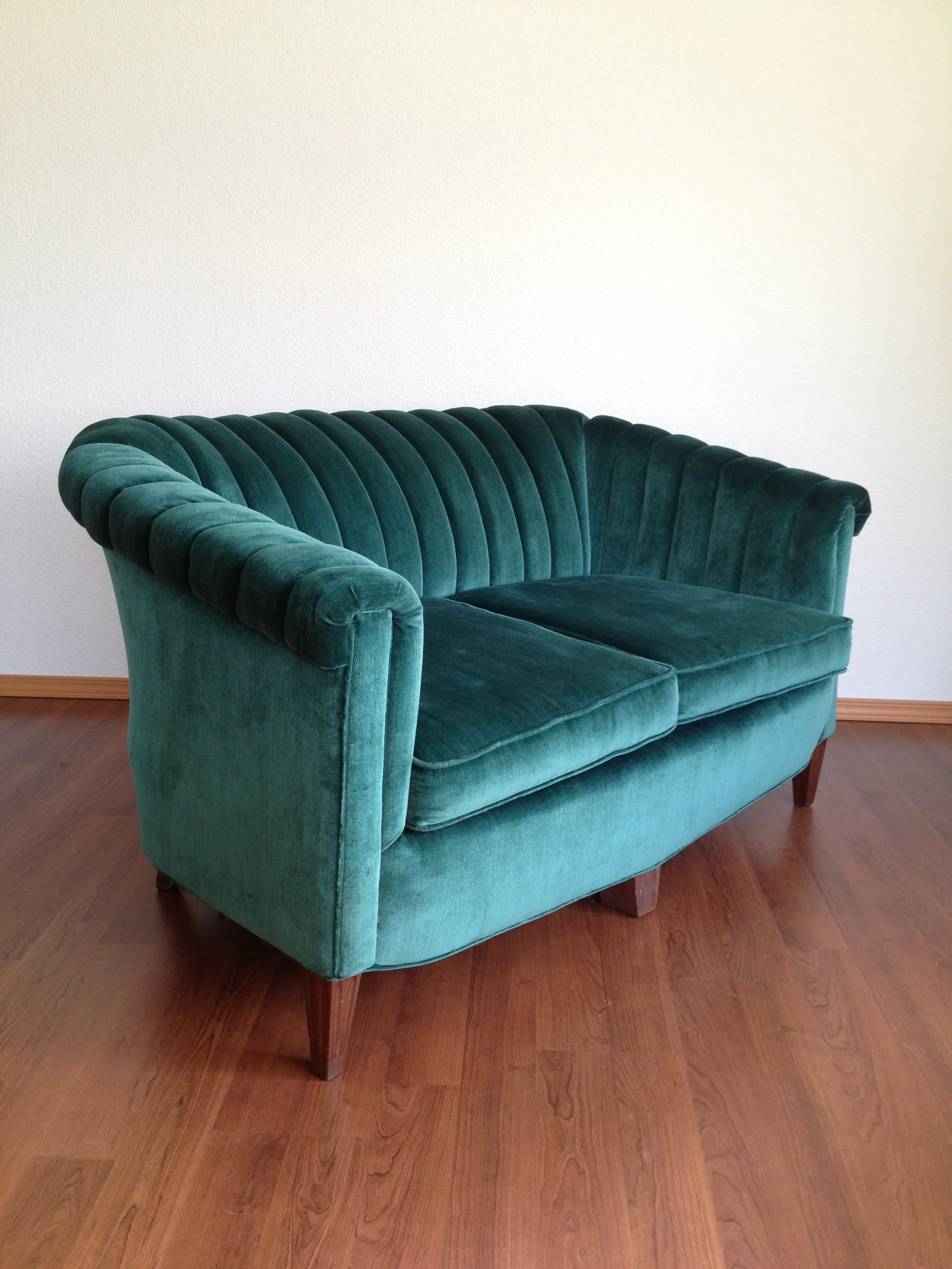 vintage emerald green channel back loveseat.
