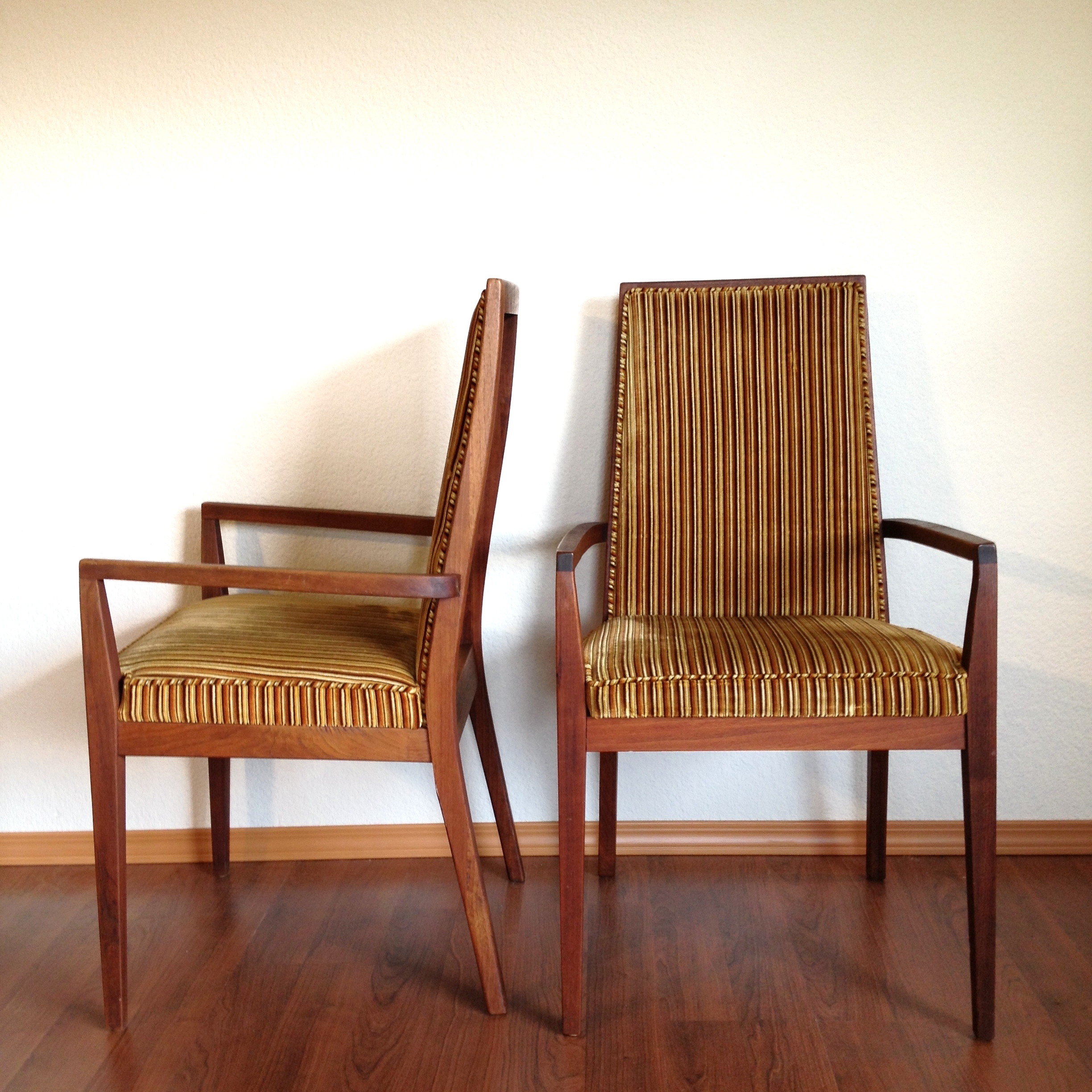 pair of mid century modern striped chairs.