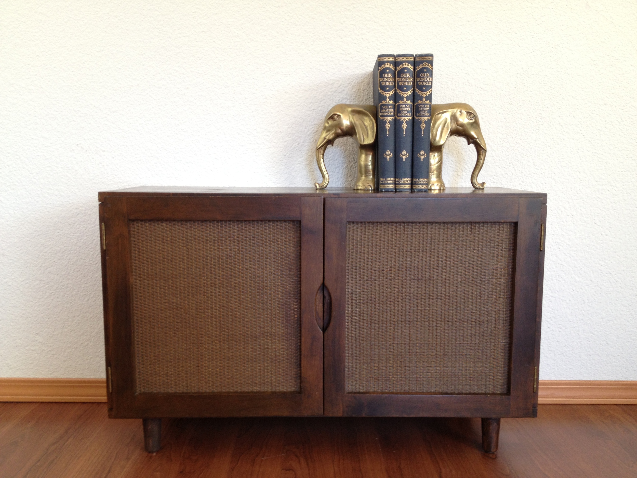vintage mid century cabinet with reversible door panels.