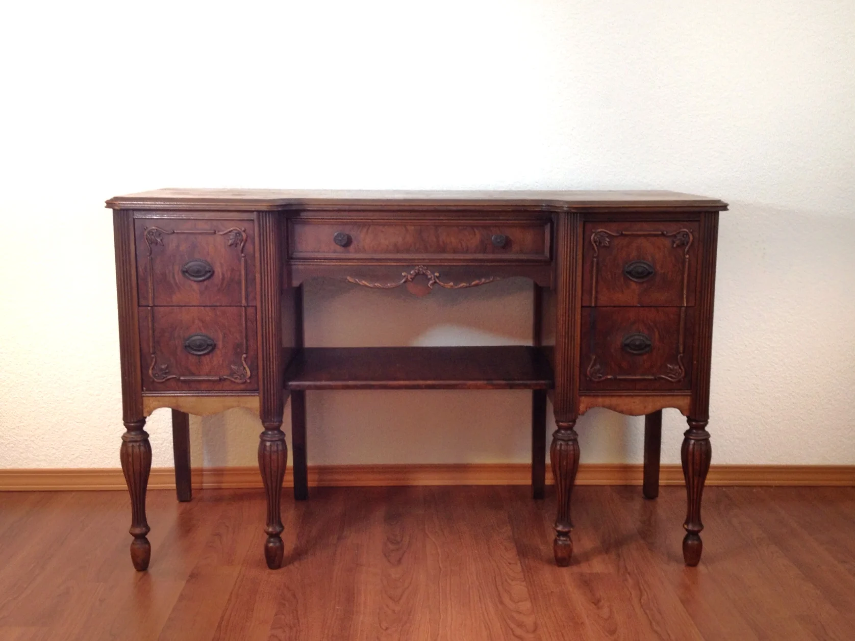 antique lady's desk with gingerbread details.