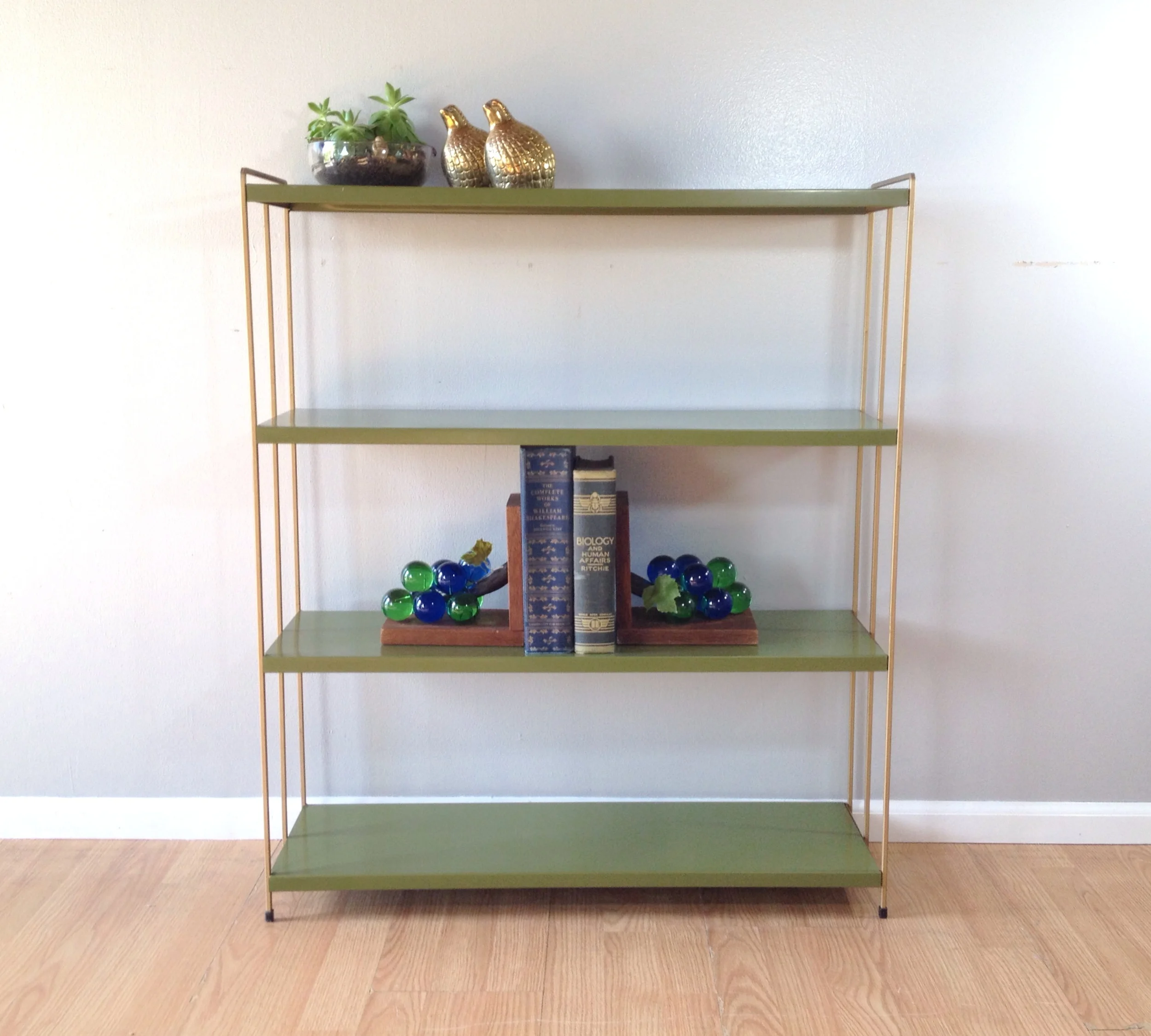 vintage avocado metal bookshelf.