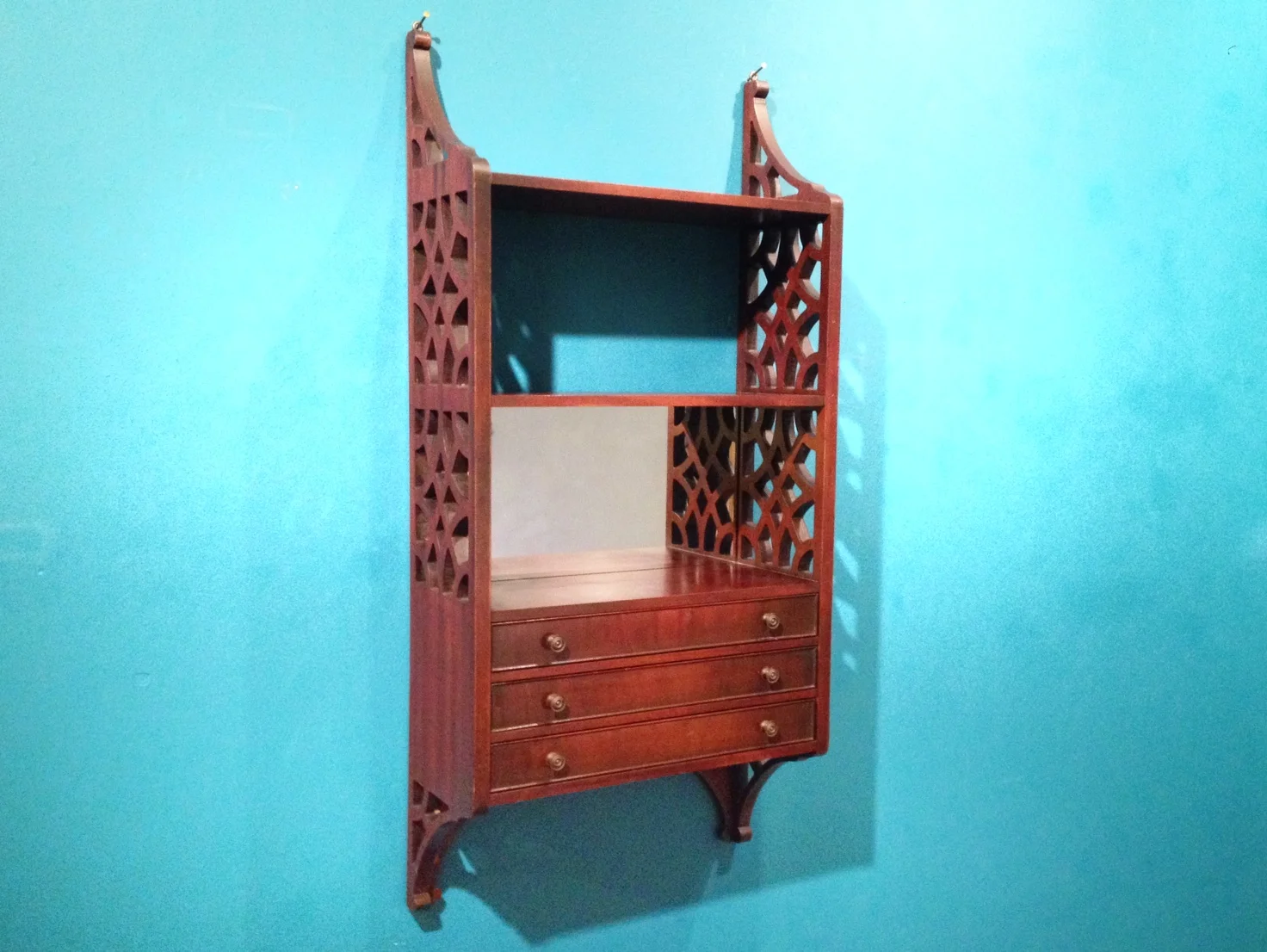 vintage hanging curio cabinet.