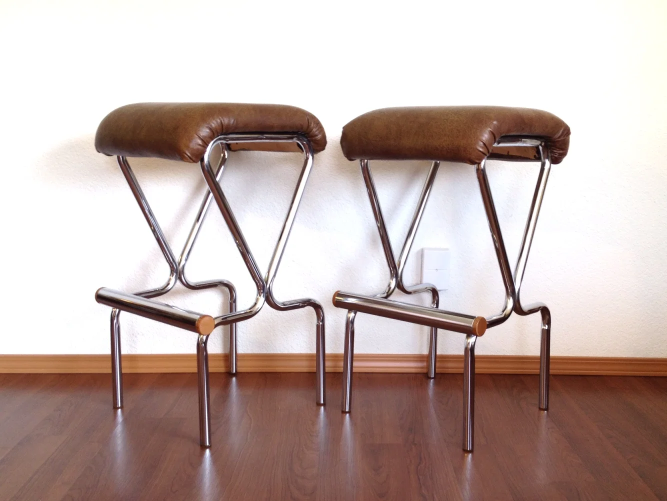 pair of vintage chrome barstools.