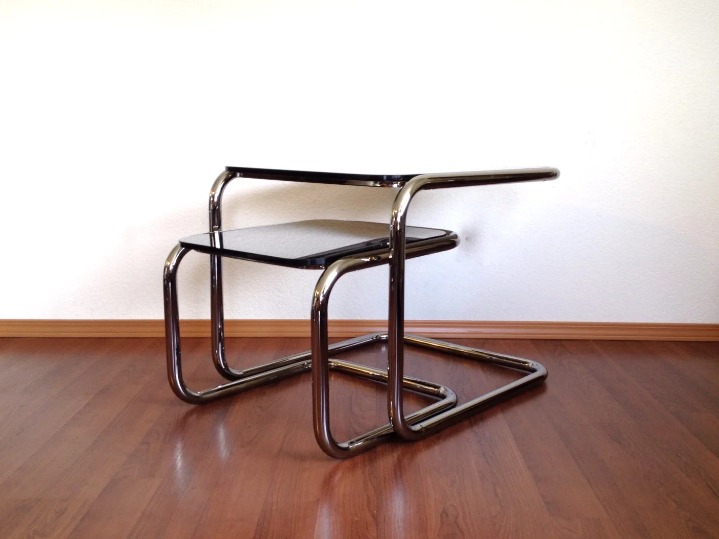pair of vintage chrome cantilever nesting tables.