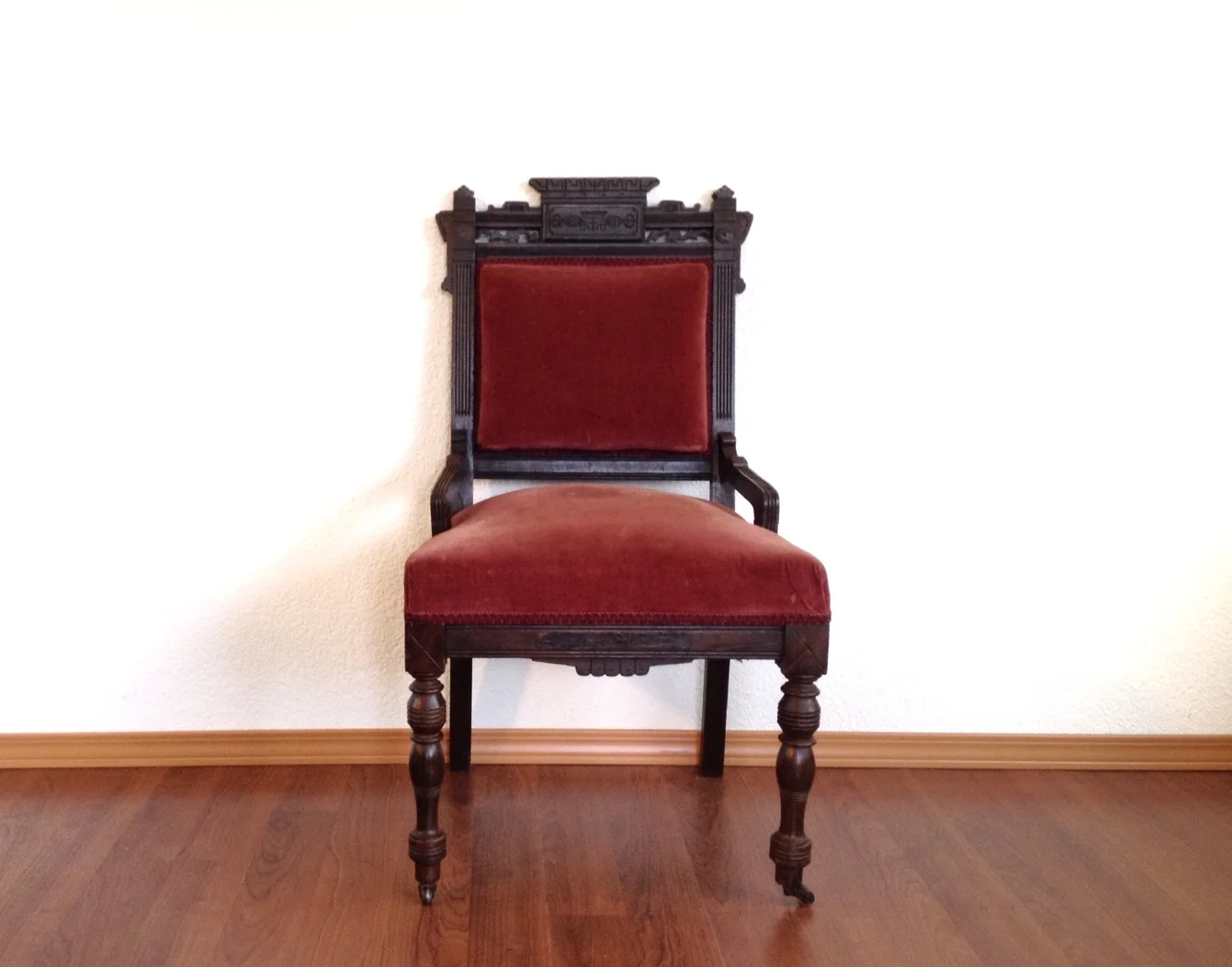 antique red velvet Eastlake chair.