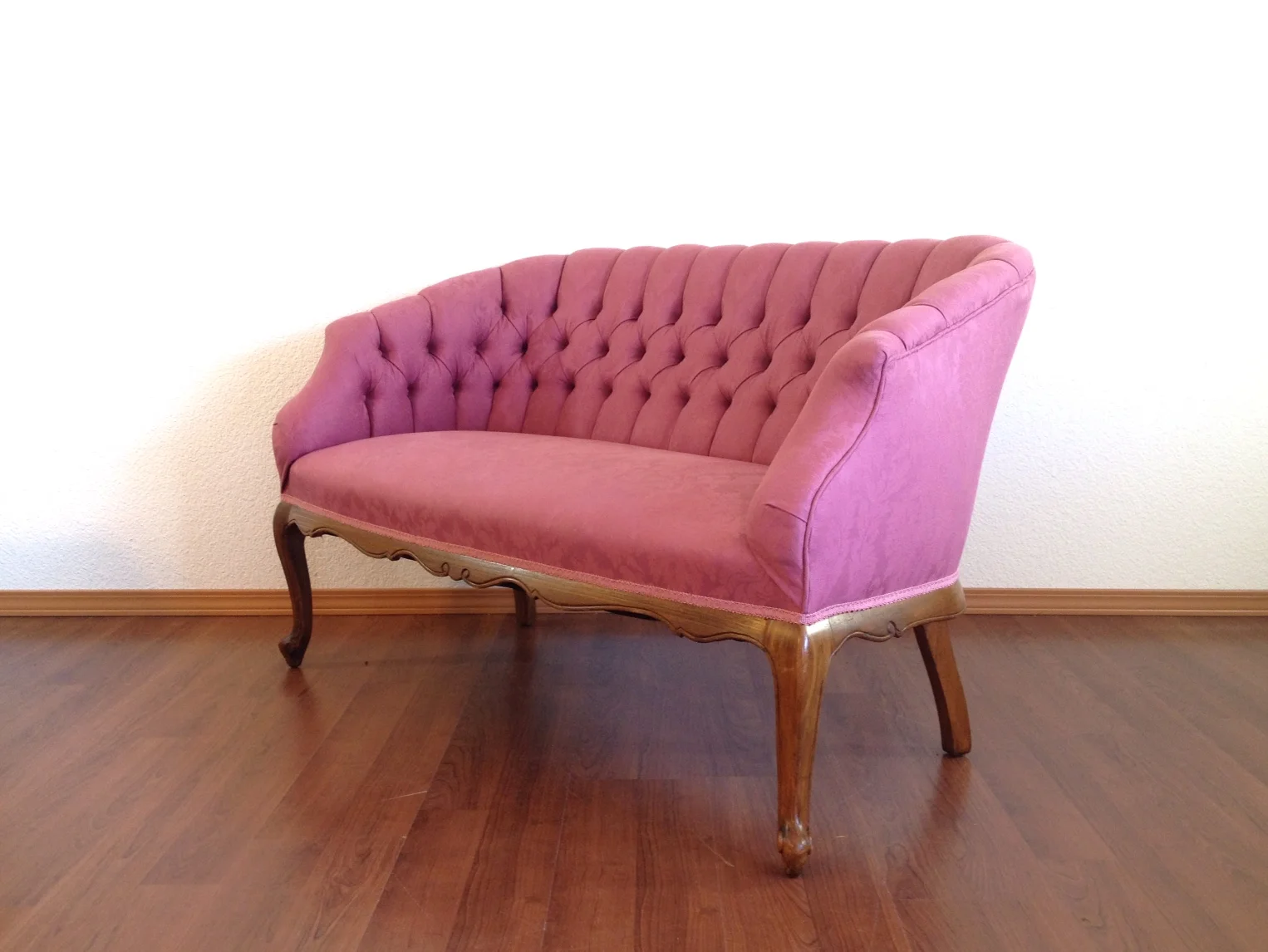 vintage pink tufted settee.