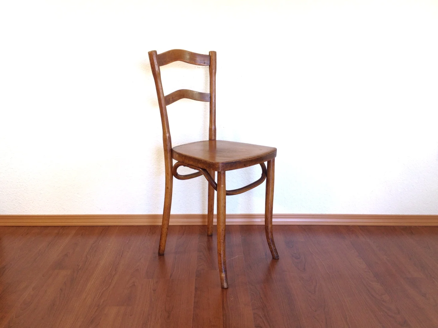 set of 4 primitive bent wood chairs.