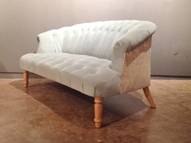 retro style powder blue tufted loveseat.