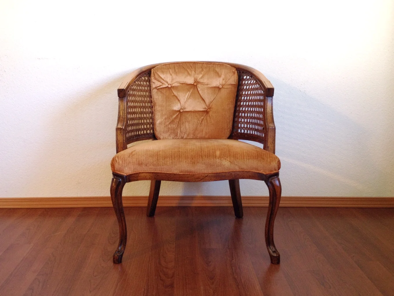 vintage Hollywood Regency cane chair.