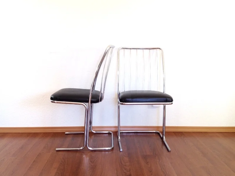 pair of mid century modern chrome cantilever chairs.