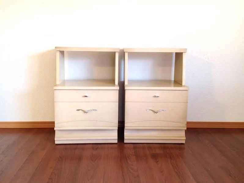 pair of mid century blonde nightstands.