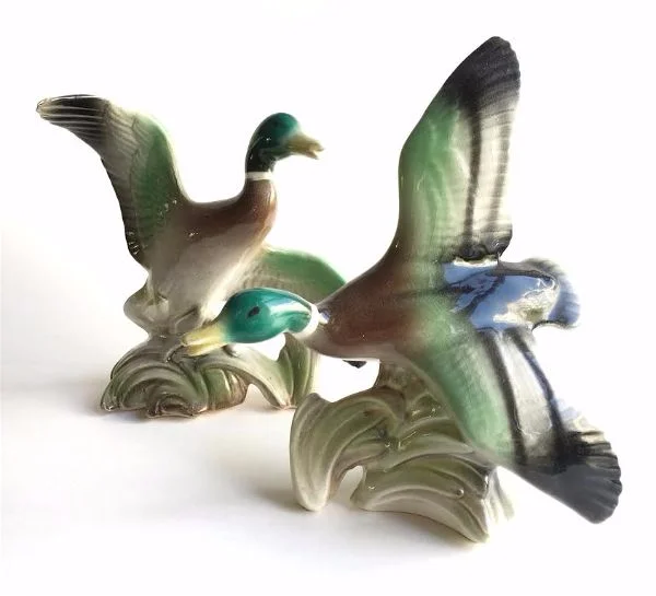 pair of vintage ceramic ducks.