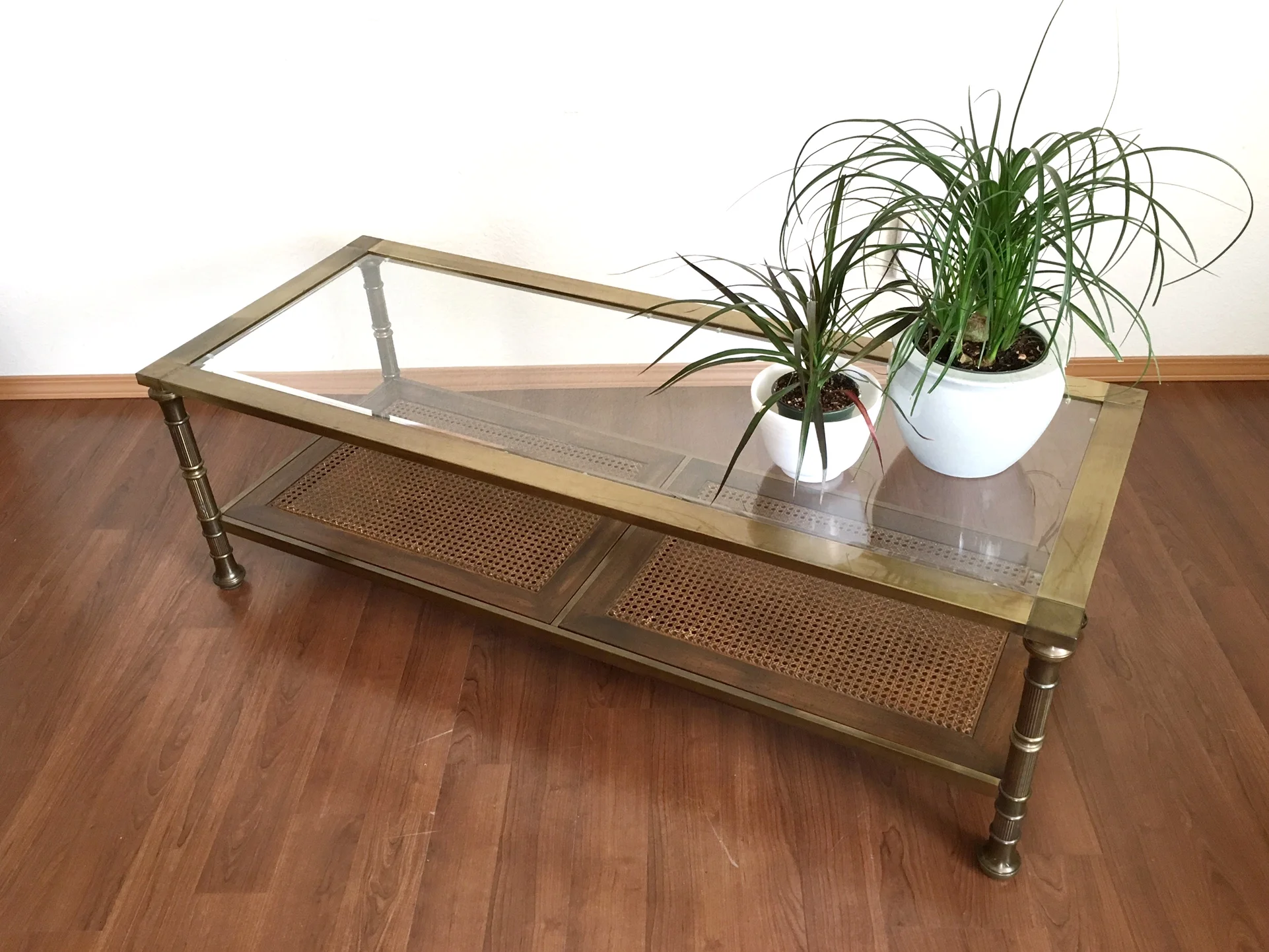 vintage brass coffee table with rattan shelf.