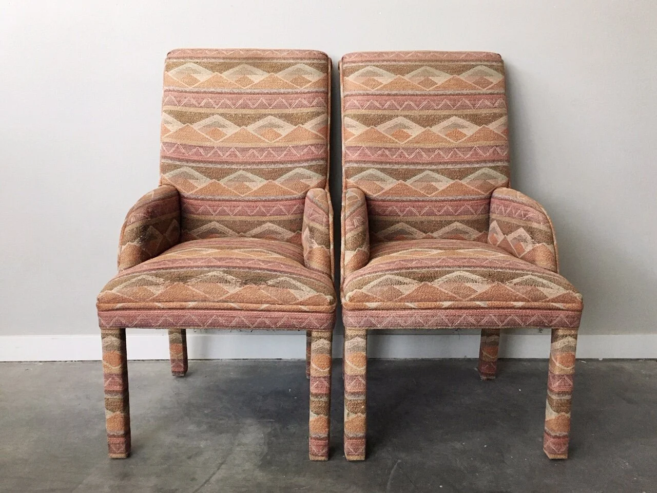 pair of vintage parsons chairs with low arms.