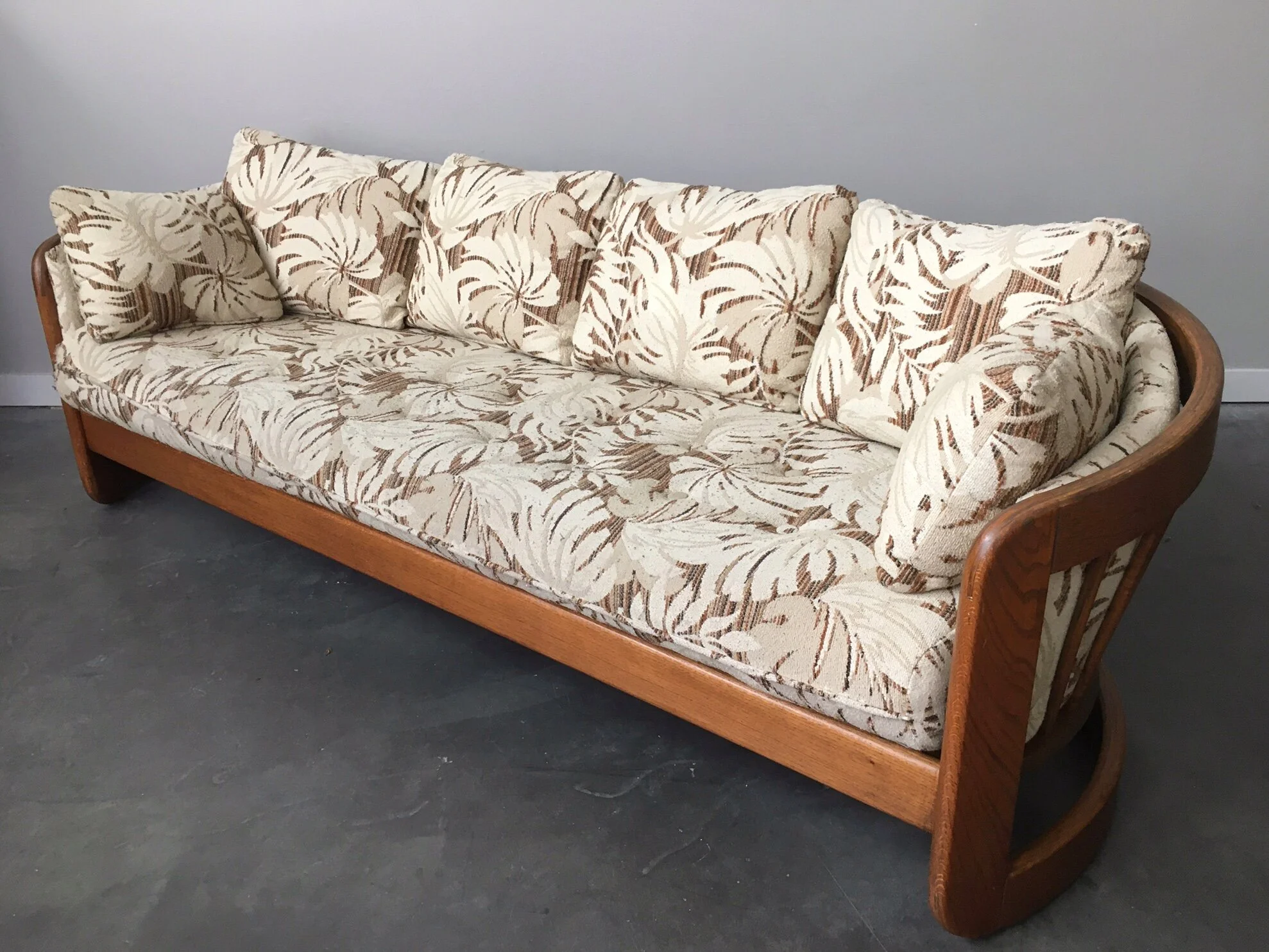 vintage 1970s oak sofa in monstera print by Howard Furniture