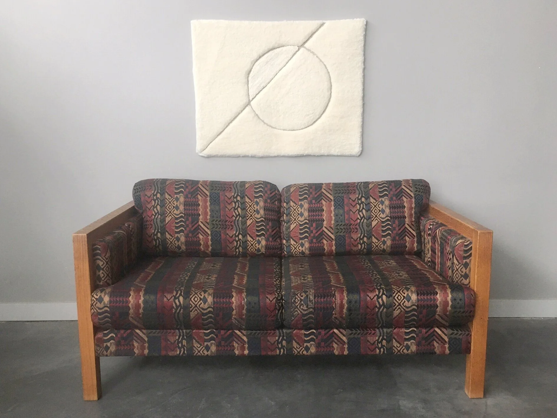 vintage mid century modern loveseat in graphic print upholstery