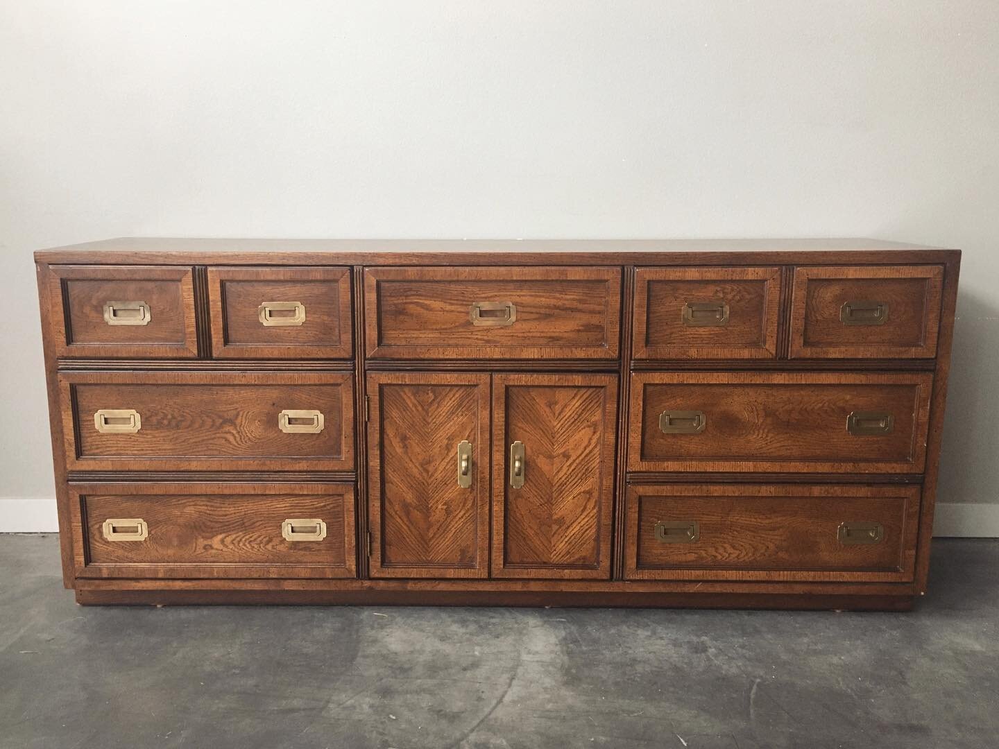 Vintage mid century campaign style lowboy dresser. This beauty would also work great as a media console or dining room sideboard. 
⁠⠀
✨Shop link in bio⁠⠀
⁠⠀
✨Viewing appointments available 7 days a week⁠⠀
⁠⠀
✨DM with questions or to schedule a viewin