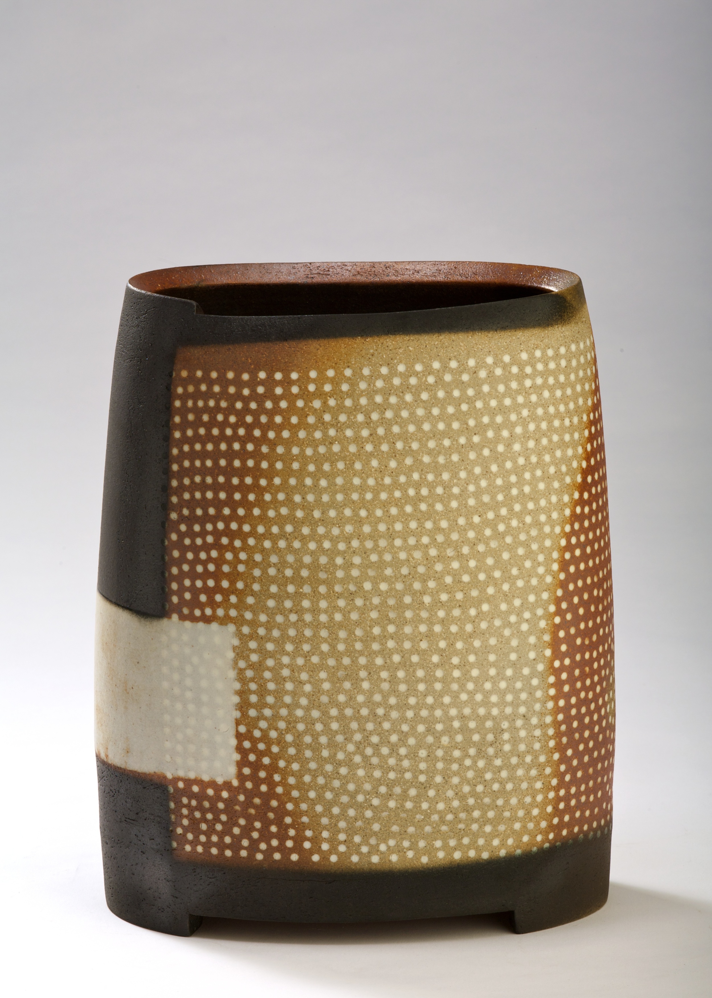  Thrown altered and cut form.  embossed pattern with Inlaid slip.  Stoneware  350mm H  2009 