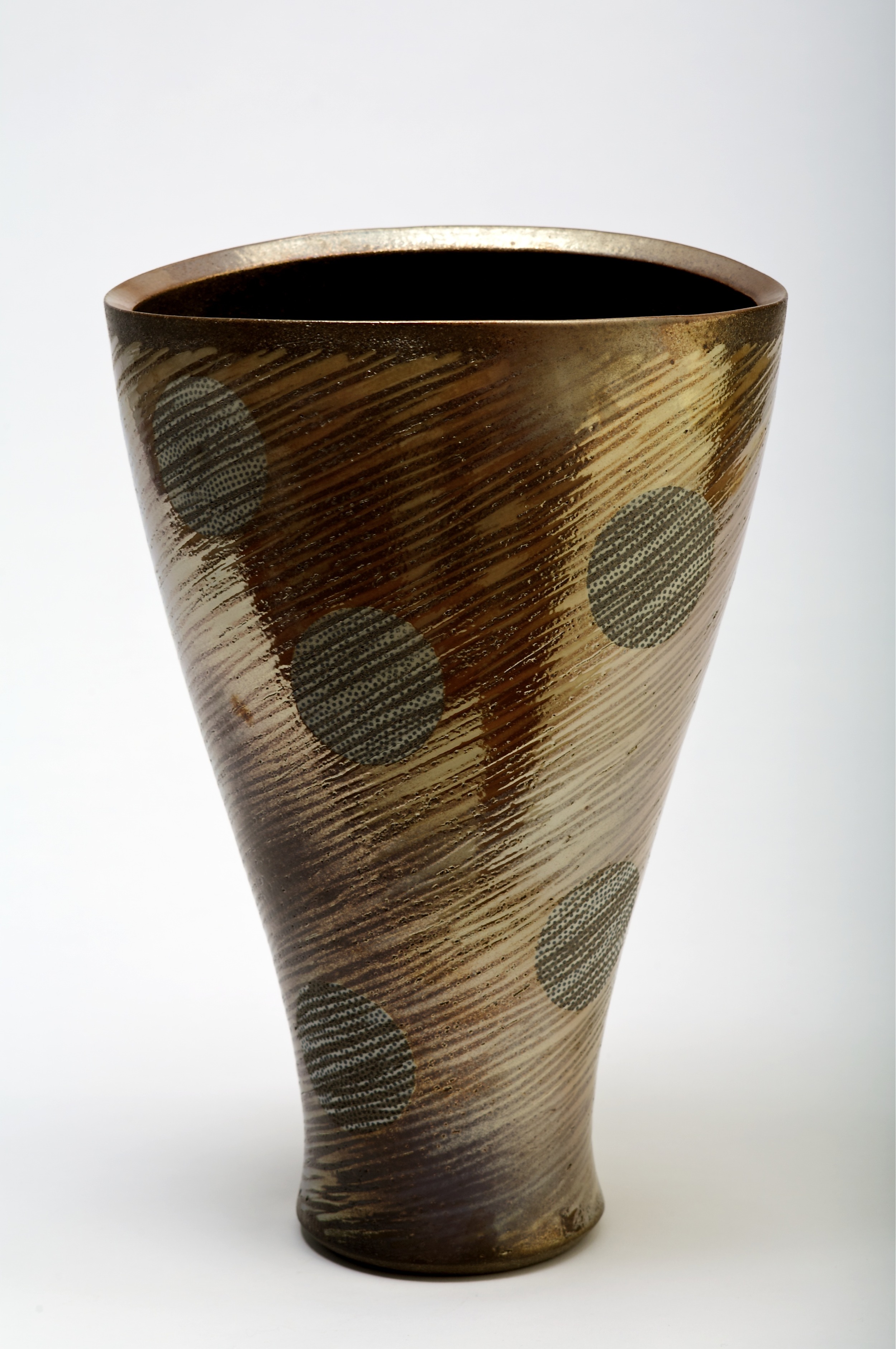  thrown and altered stoneware form.  incised pattern with inlaid slip.  Fired in charcoal with Mt Gibraltar granite lustre  420mm H 