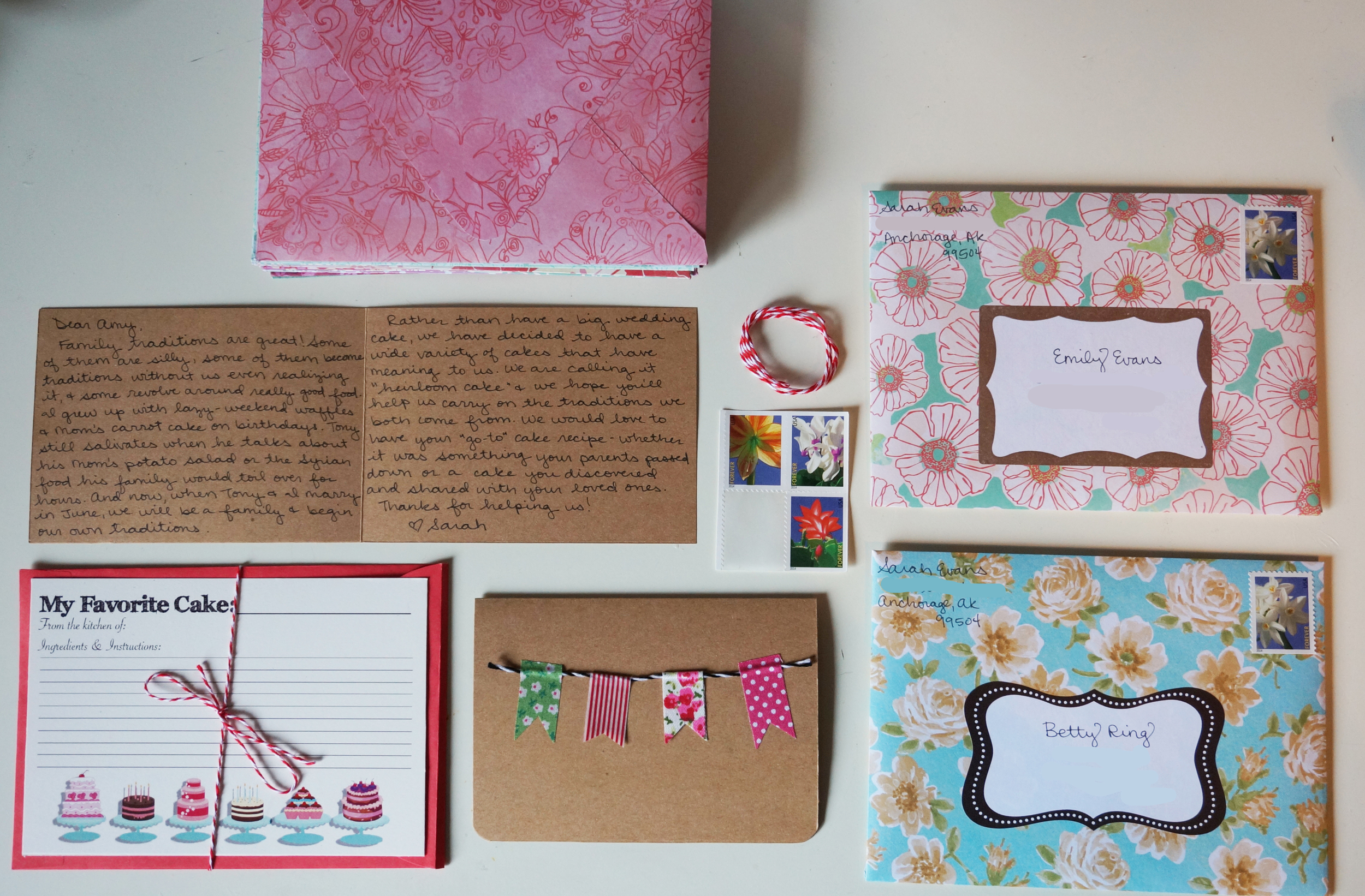 All handmade cards using supplies on hand: homemade envelopes made from scrapbook paper, bunting cards made with cardstock, baker's twine, and washi tape, and recipe card designed in Photoshop and printed at Kinko's for 10 dollars.