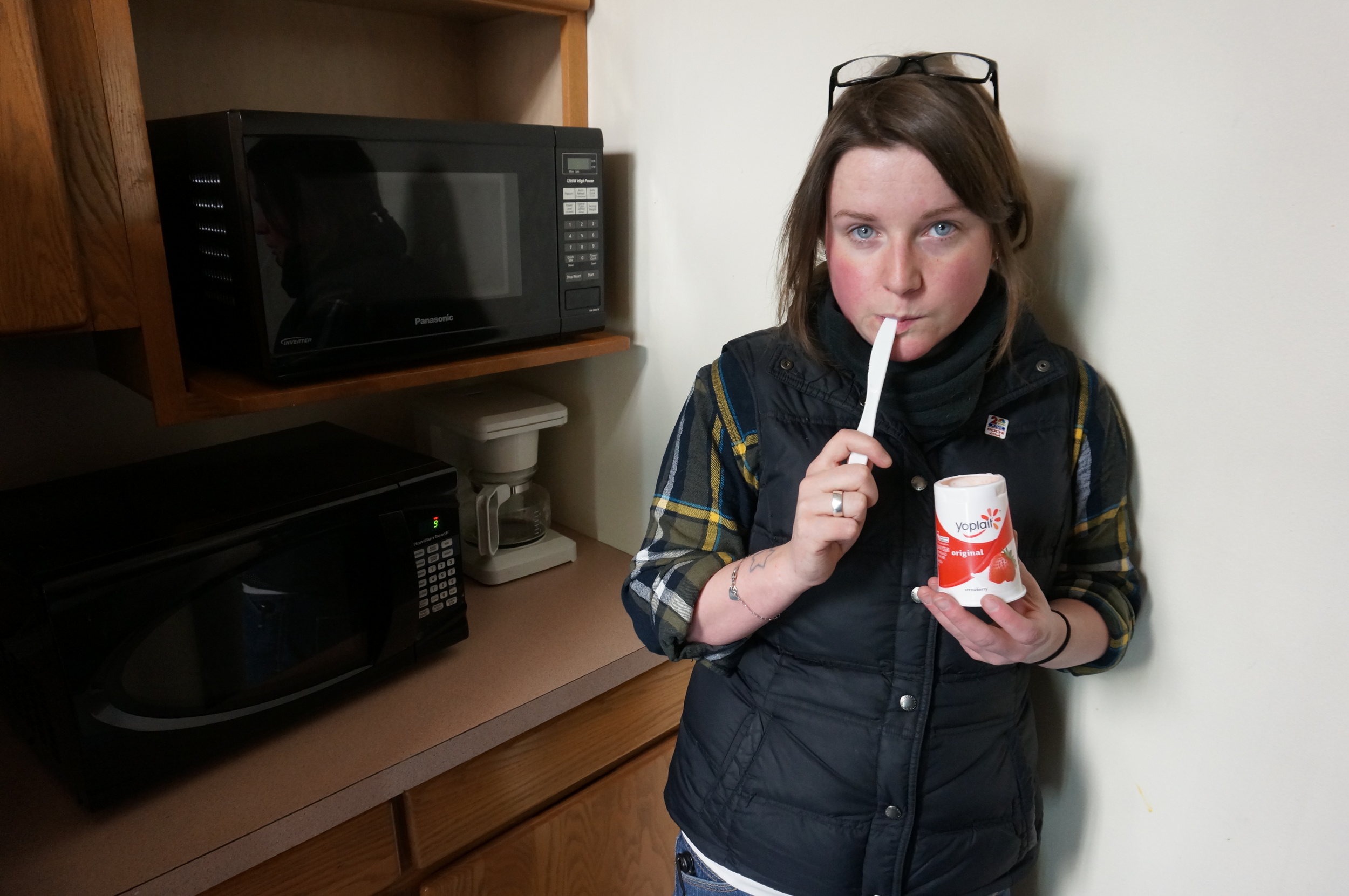 I love this portrait of my friend, Carly. All of the utensils were missing from the work kitchen, so Carly scrounged a knife to eat her yogurt.