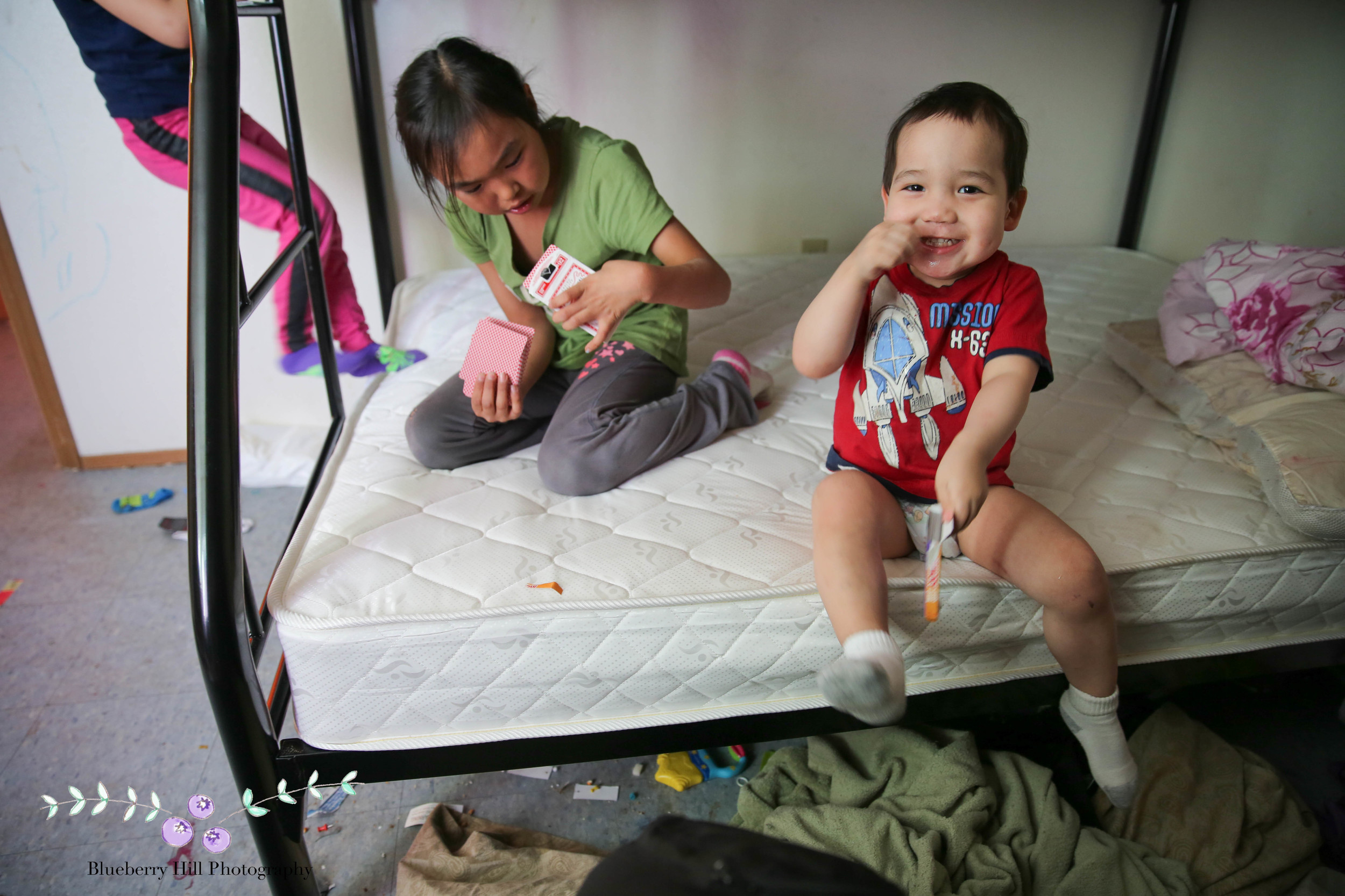 Thomas and Naomi show off their new bunk beds during parent-teacher conferences.