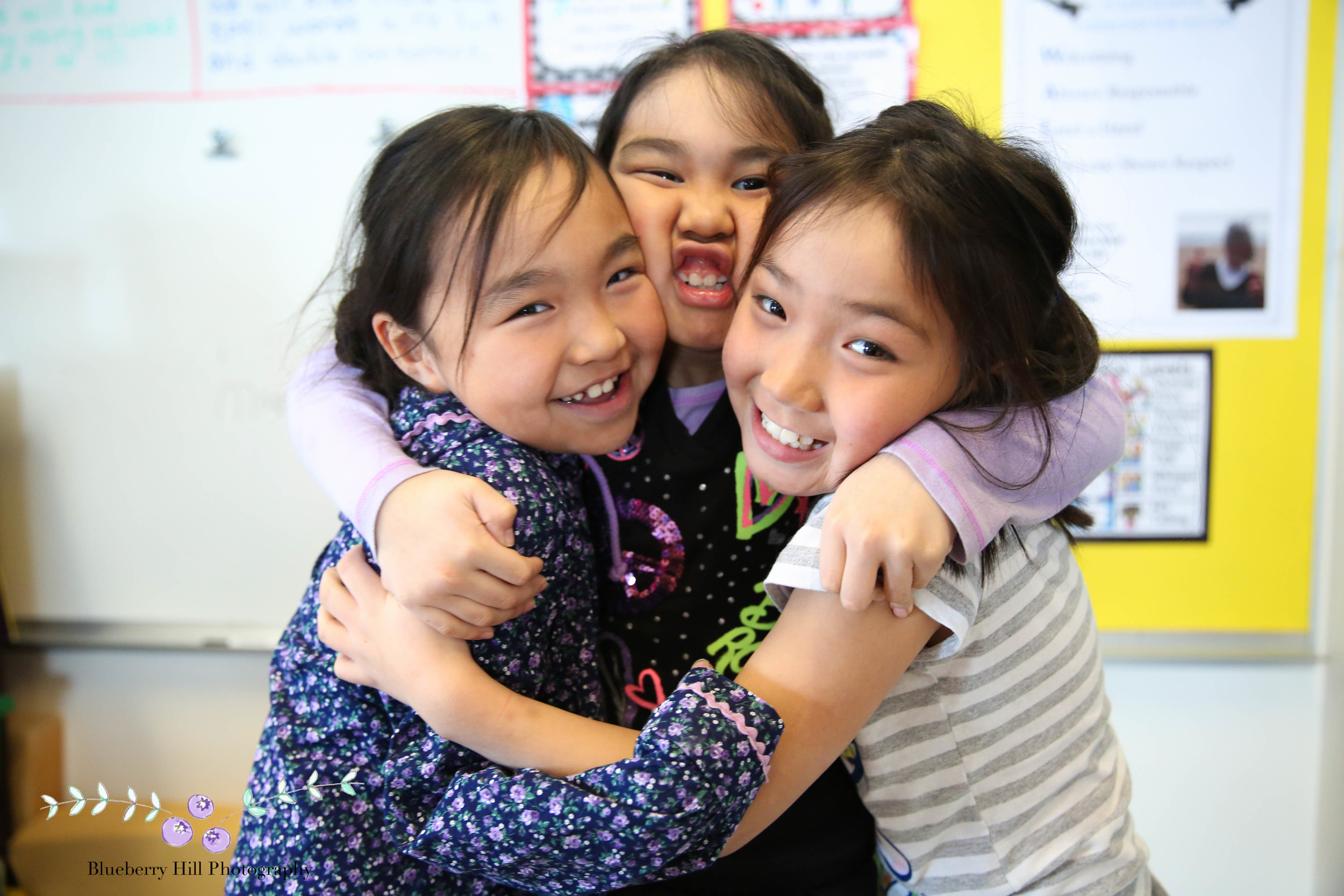 The station agent calls the school to say my plane is arriving in about 20 minutes. The girls of the second grade pose for one more picture before my flight.