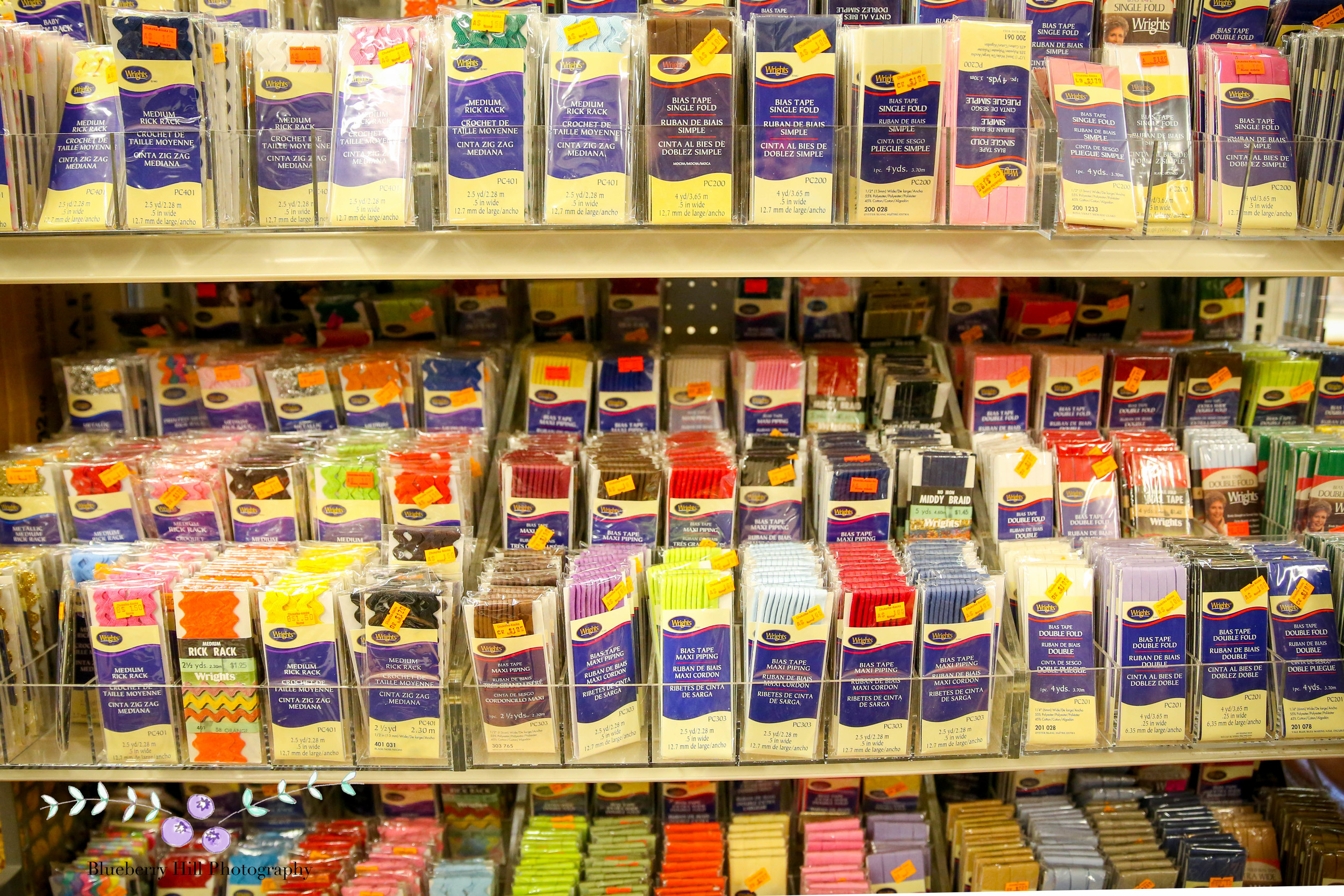 A sign you're in Qaspeq (kuspuk) country-- all the ric rac you could ever need! A shop in Nome.