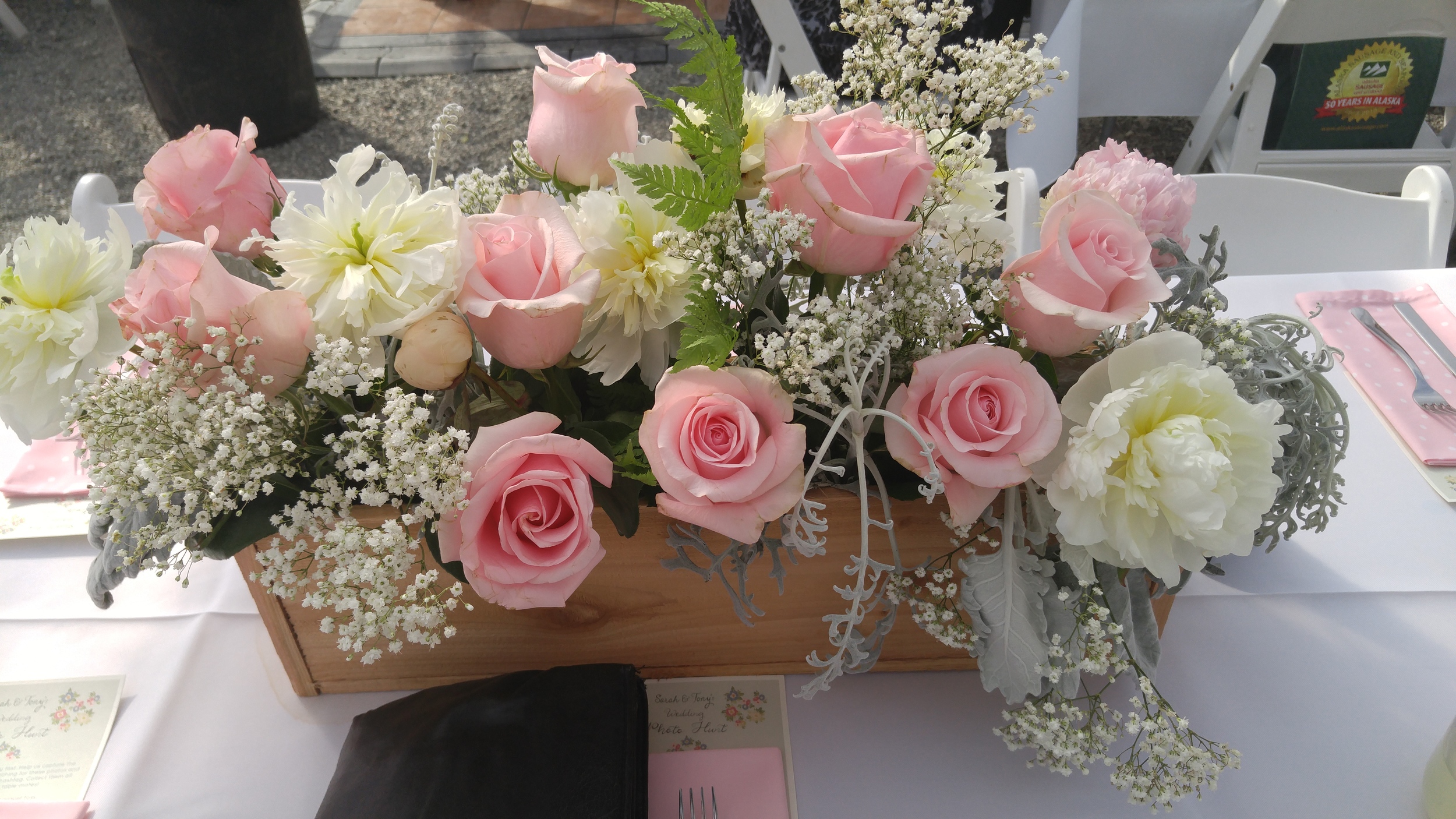 Close up on our centerpieces: wooden boxes made by Tony, flowers from Fifty Flowers, arrangement by Susan Galagaran.