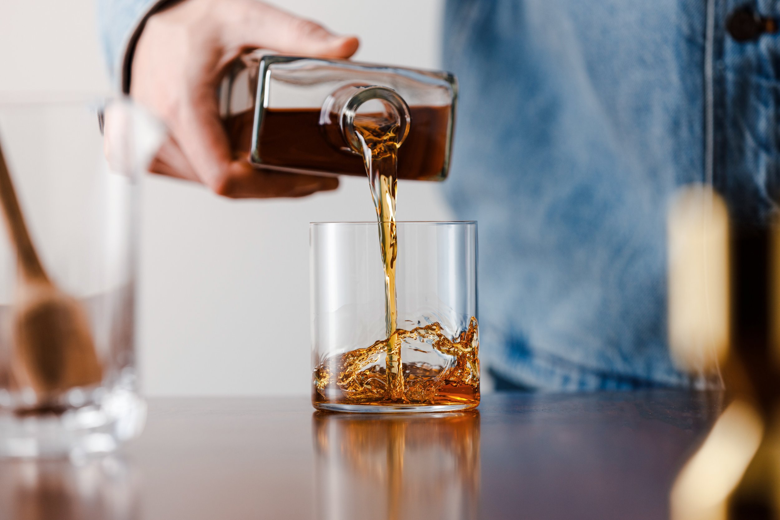 Union Horse whiskey pour photographed for a beverage campaign