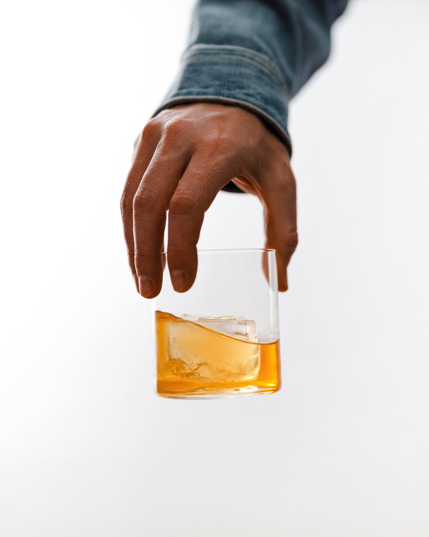 Whiskey swirling through a clear glass