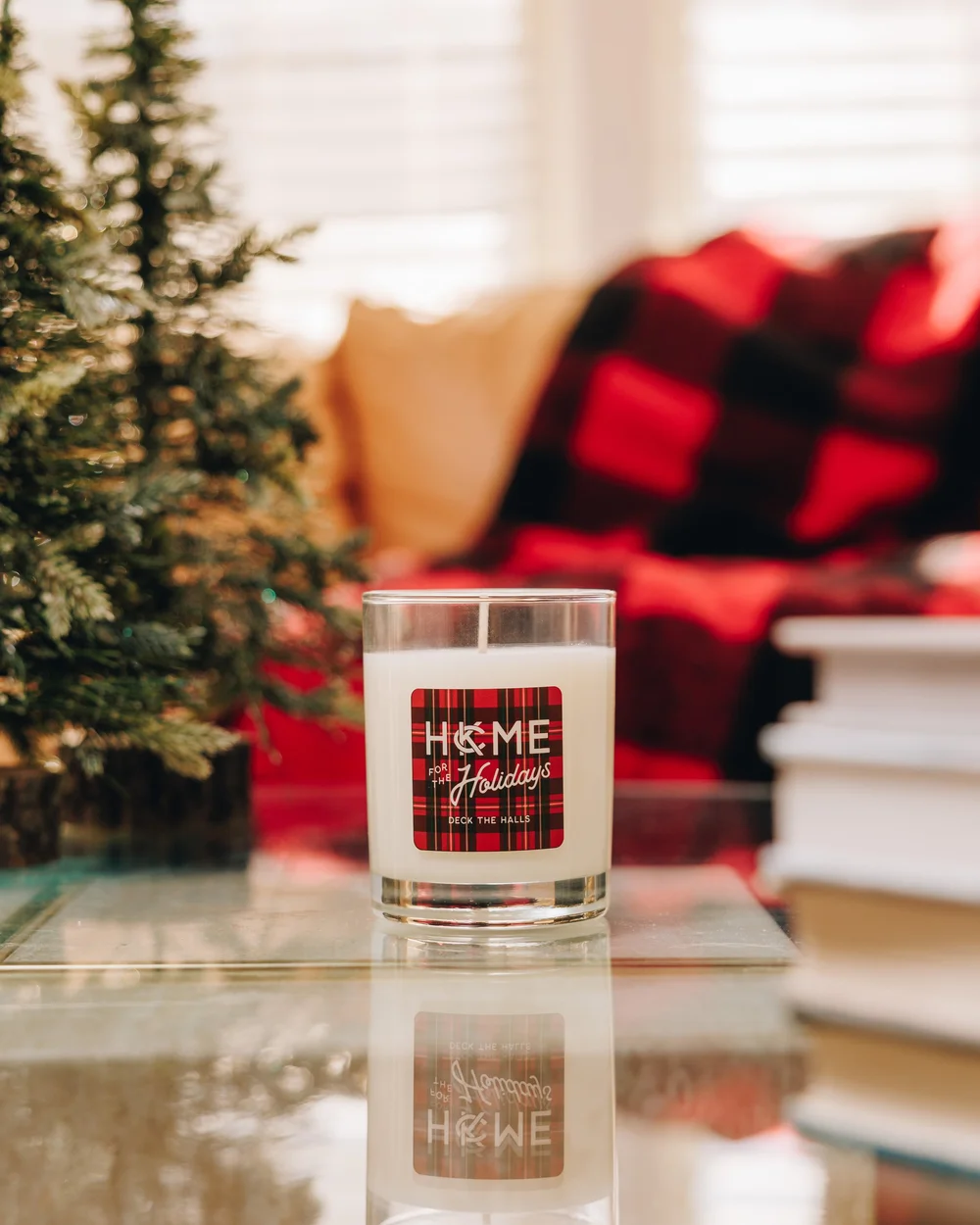 Seasonal candle photographed in a warm holiday setting