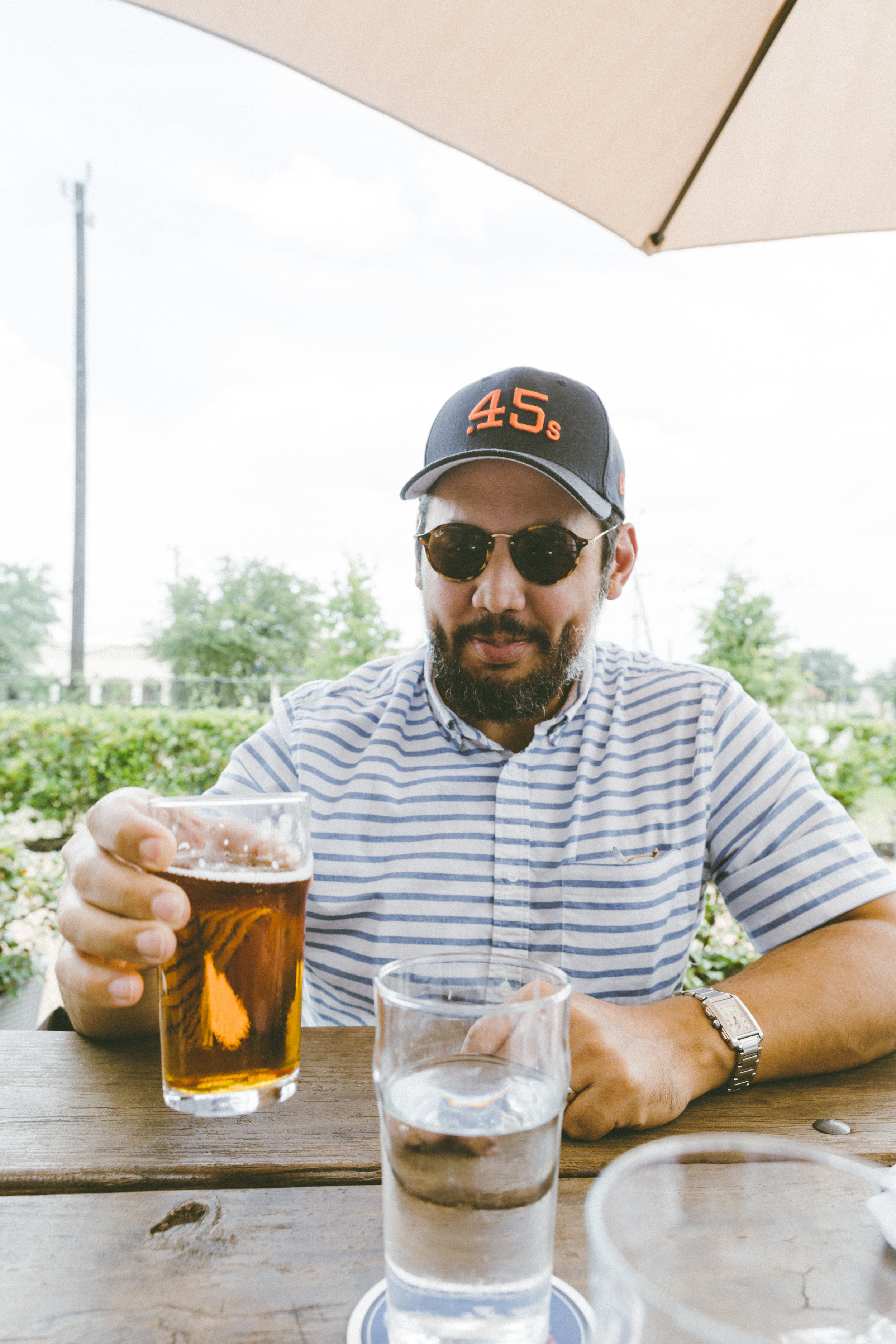 Enjoying a beer at Karbach Brewery .