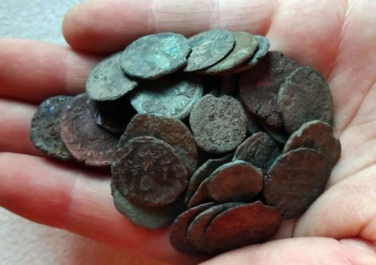 Using a metal detector, Bobby Grangier, 10, found a hoard of Roman and Greek coins, dating to 500 AD, at a shoreline site on the Chesapeake Bay in Accomack County. (Photo: Staff photo by Brice Stump)