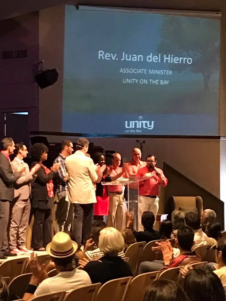 Rev. Chris announcing to the community on Sunday, Feb. 5, 2017 that Rev. Juan del Hierro is now promoted from Assistant Minister to Associate Minister of Unity on the Bay.