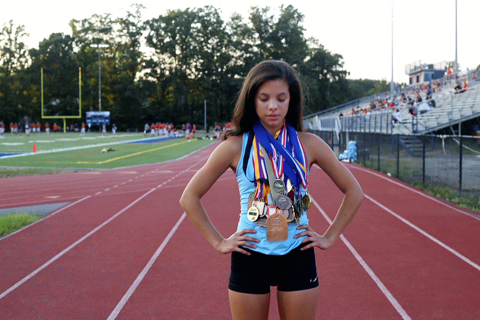She may be a fierce force of nature on the track, but in conversation Regan's humility and soft-spoken nature shines through. When I started to praise her for her accomplishments, she smiles and says to me "I'm really not THAT good" ...and then continues to take out these medals from her bag.